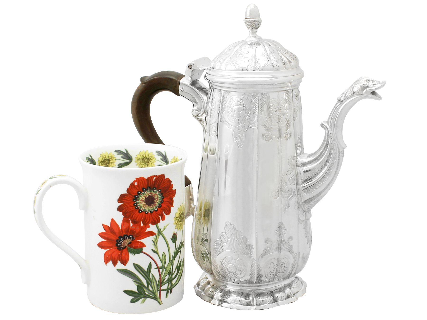 An exceptional, fine and impressive antique Georgian English sterling silver coffee pot made by John Pollock; an addition to our silver teaware collection.

This exceptional antique George II sterling silver coffee pot has a tapering cylindrical