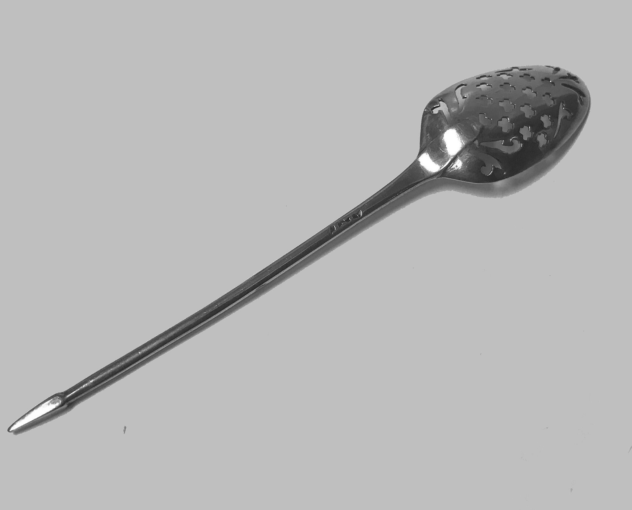 Antique Georgian English sterling silver mote spoon, English, circa 1740. The mote spoon with oval pierced bowl, narrow stem style handle and pointed terminal. Length: 5 inches. Weight: 8.52 grams. Stamped with makers mark (untraceable) and lion