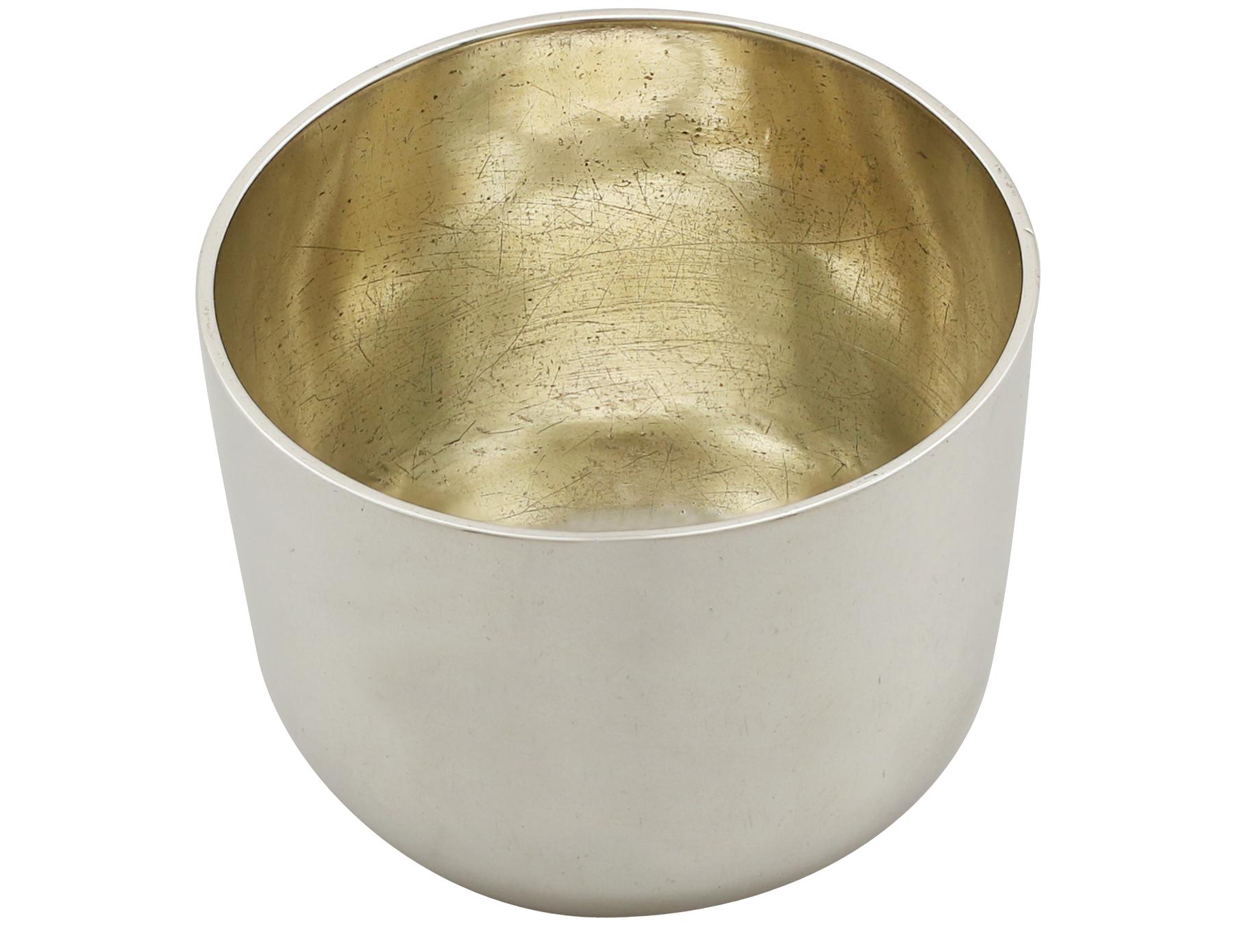 A fine antique Georgian English sterling silver tumbler cup; part of our dining silverware collection

This impressive antique Georgian sterling silver tumbler cup has a plain circular rounded form.

The surface of this George II cup is plain