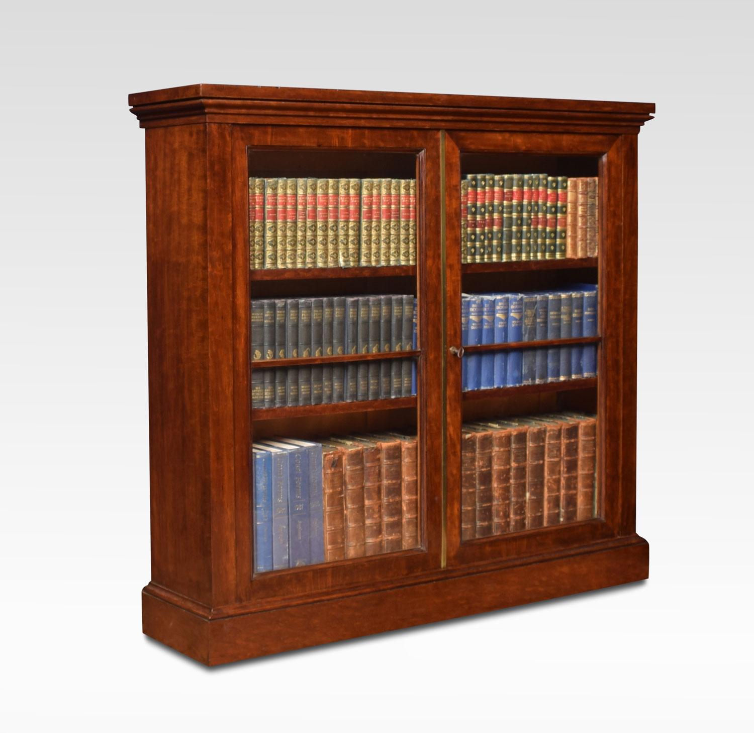 Georgian figured mahogany dwarf bookcase, the large rectangular moulded top above two glazed panelled doors opening to reveal adjustable shelved interior. The door is fitted with a Bramah lock. All raised up on plinth base.
Dimensions:
Height 42
