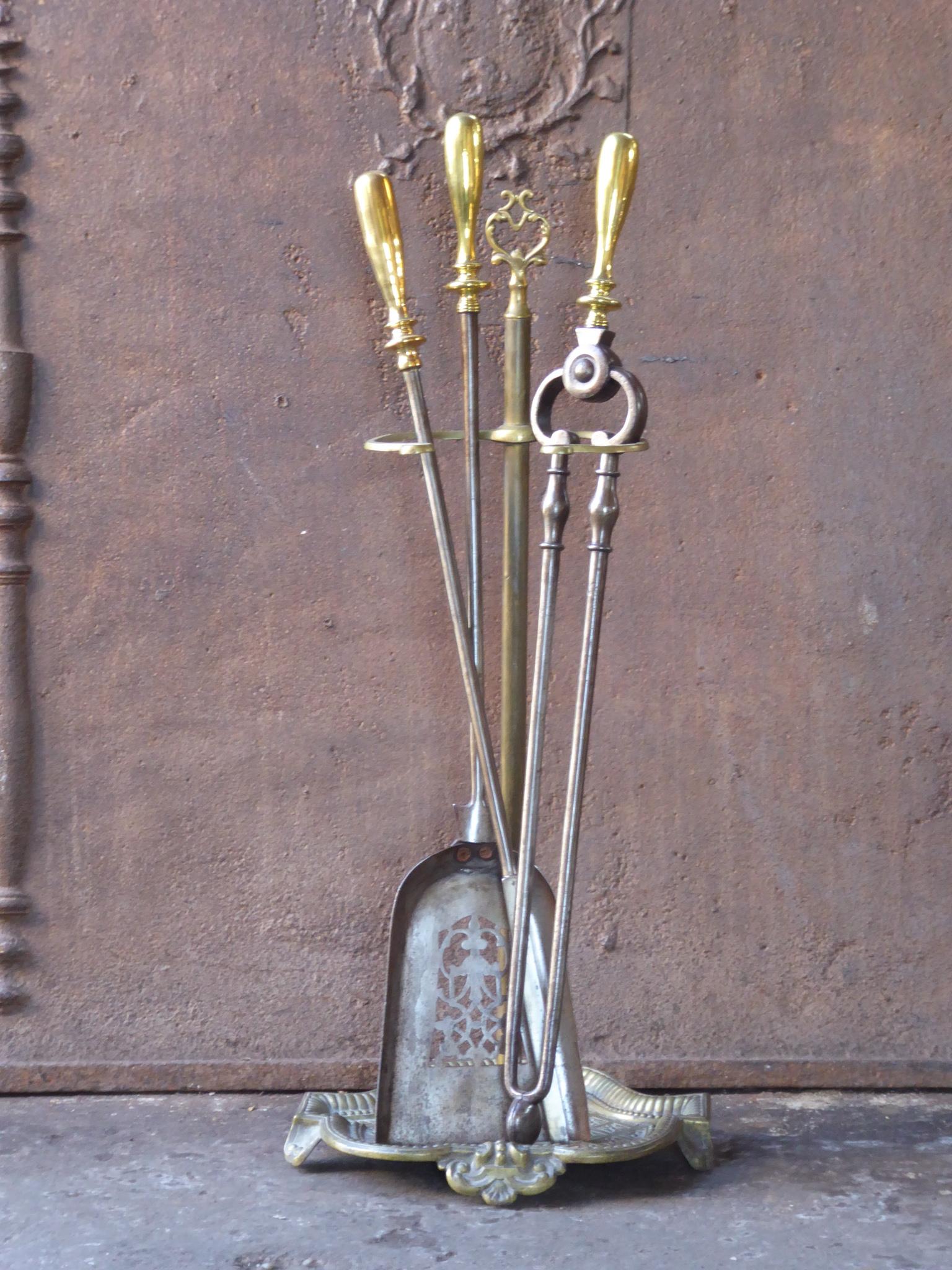 Beautiful set of three Georgian fireplace tools and a stand, made of steel and brass. Made in England, 18th-19th century. The companion set is in a good condition and is fully functional.








