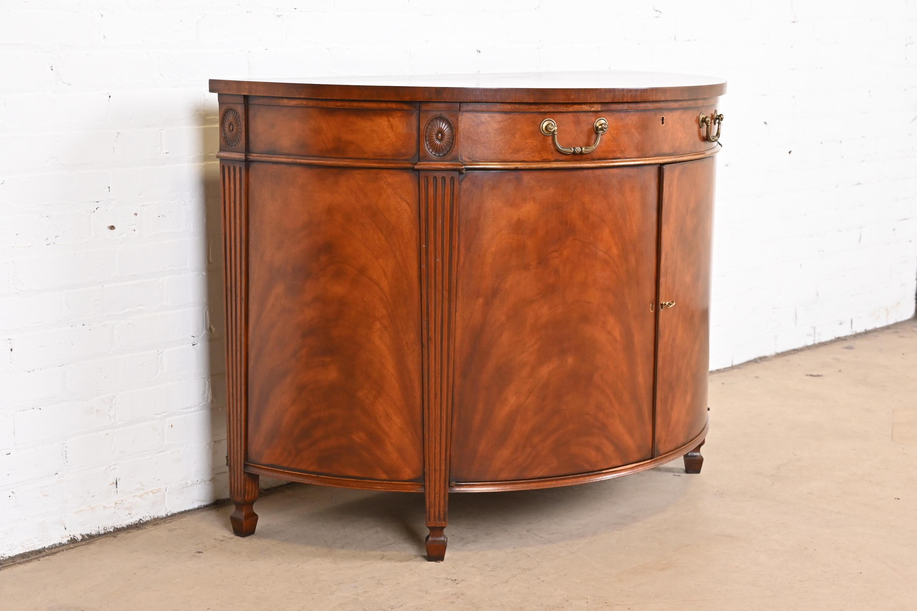 Brass Georgian Flame Mahogany Demilune Cabinet in the Manner of Baker Furniture
