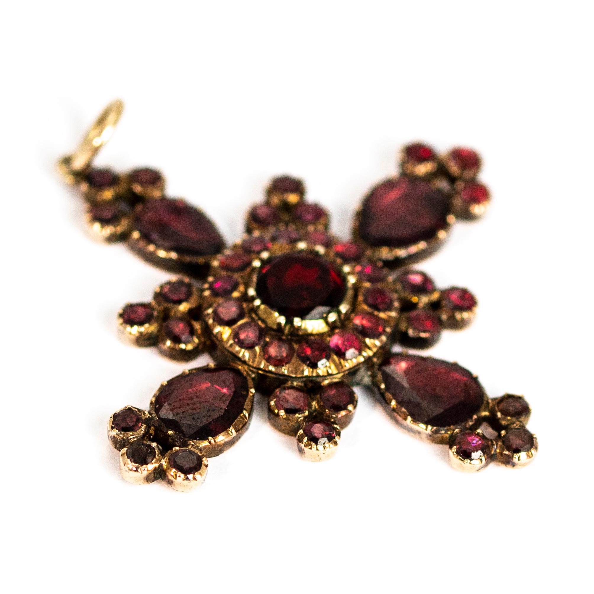 The flat cut garnets in this pendant have a wonderful deep colour and a fantastic sparkle. In the Georgian period, garnets were one of the most desirable gemstones. The style of this pendant means that you see mostly stone instead of gold as the