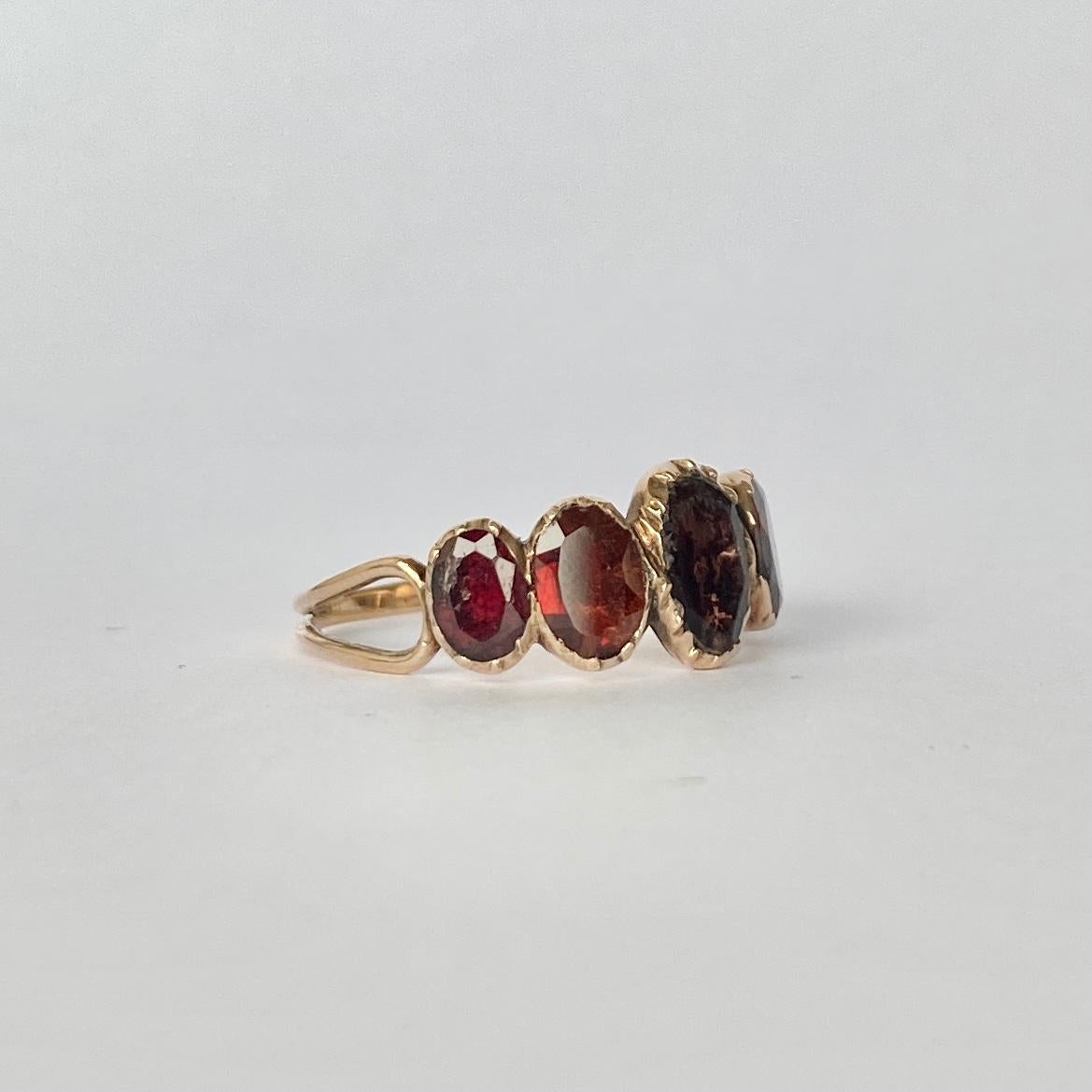 The gorgeous georgian flat cut garnets in this band are a wonderful large size. When wearing the band it has a lovely chunky look to it and also looks as though it could be a full eternity band. The shoulders have an open look which come together on
