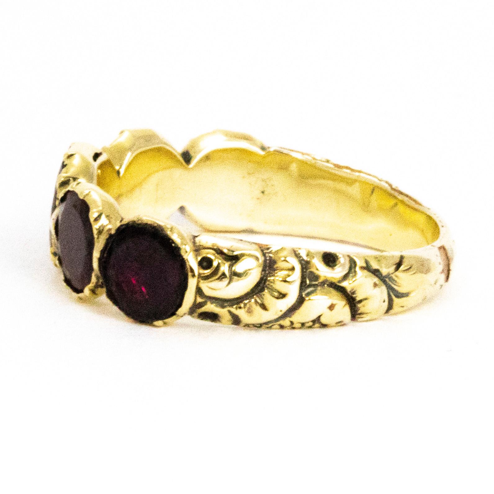 The gorgeous georgian flat cut garnets in this band are a wonderful large size. When wearing the band it has a lovely chunky look to it and also looks as though it could be a full eternity band. The shoulders are actually exquisitely engraved and