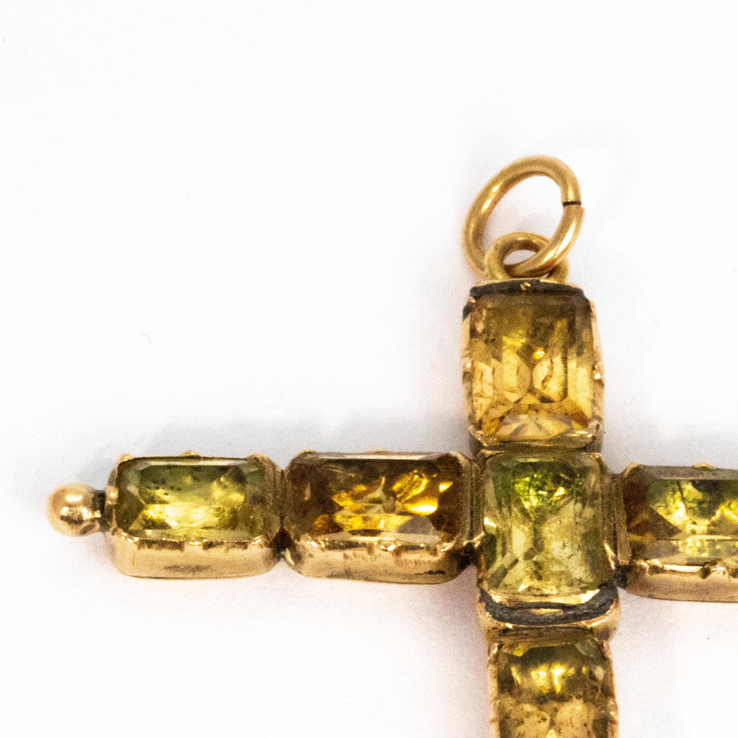 This gorgeous cross pendant golds a total of nine citrine stones measuring approximately 50pts each. The stones are foiled to create a wonderful reflection of light. The foiled settings create a lovely smooth finish to the back of the pendant which