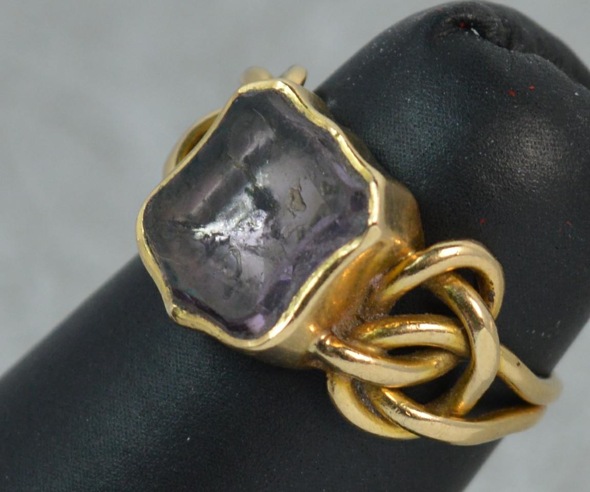 A fantastic Georgian era signet style ring. Circa 1820.
SIZE ; J UK, 4 3/4 US and sizeable
Modelled in 15 carat yellow gold with simple shank and forget me not entwined gold sides.
The front is designed with a shield to front, 9mm x 10mm head.