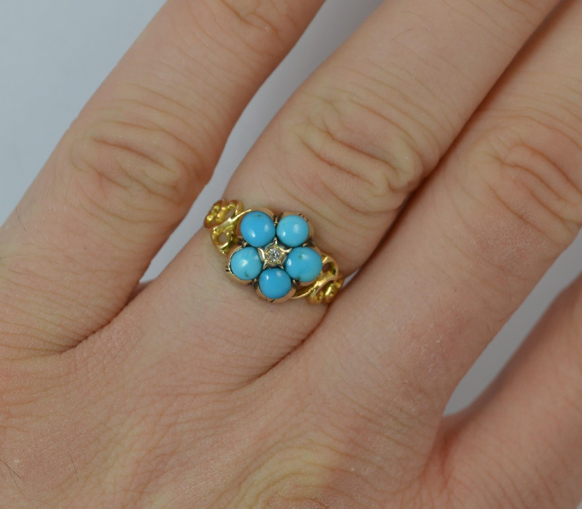 A lovely Georgian period forget me not ring.
SIZE ; L UK, 5 3/4 US
​Beautiful cluster head set with a five natural turquoise stones surrounding a small old cut diamond of floral shape. 10mm x 10mm head. Pierced floral sides.

Solid 15 carat yellow