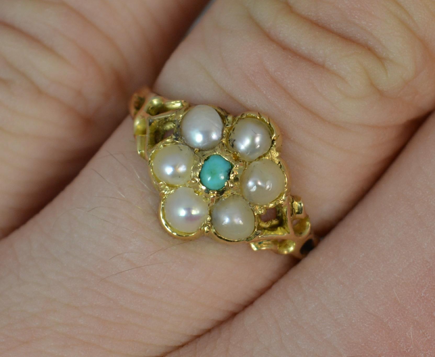A superb Georgian period cluster ring. 
SIZE ; M 1/2 UK, 6 1/2 US
18 carat yellow gold example.
Designed with a turquoise to the centre of six creamy pearls with pierced shoulders.
9.5mm x 11mm cluster head.

CONDITION ; Very good for age. Clean and