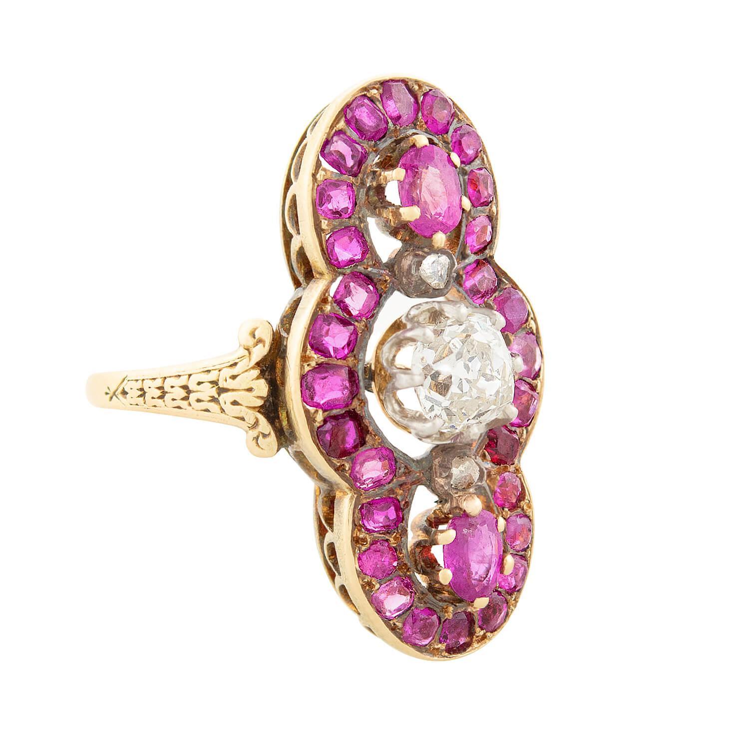 A breathtaking ring from the Georgian (ca1790s) era! Crafted in 18k yellow gold, this ring features an incredible navette centerpiece. The centerpiece features a central, large old mine cut diamond which is bordered above and below by two smaller