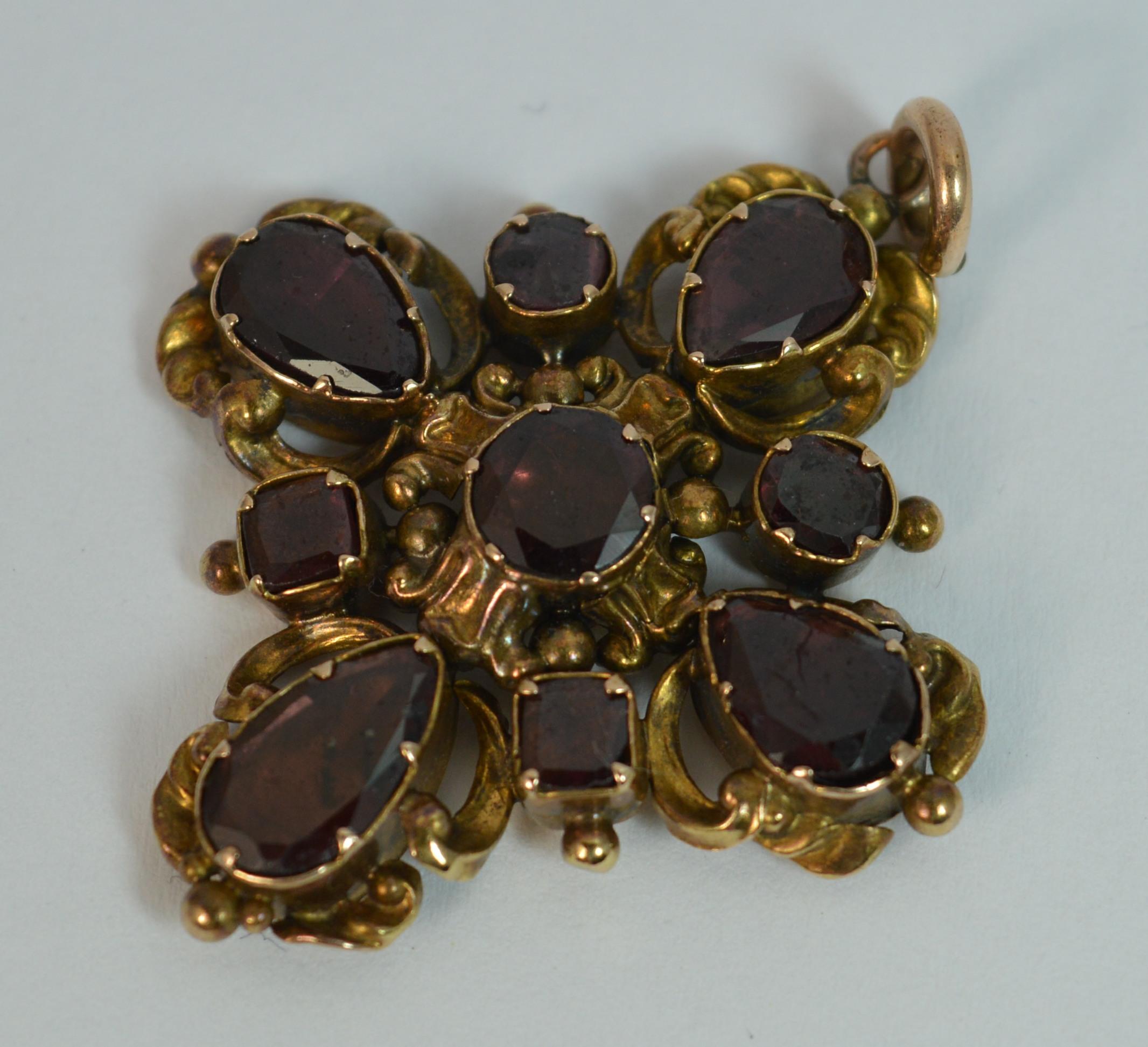 
A rare true Georgian period pendant or brooch circa 1790.

Solid 15 carat gold example set with natural garnets.

The pear and round shaped flat cut garnets each in closed back settings.


CONDITION ; Good for age. Well set stones, issue free.