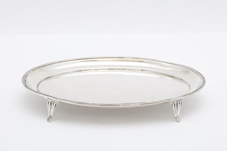 Georgian (George II) - style,sterling silver, footed salver London, year-hallmarked for 1915, George Nathan and Ridley Hayes - makers. Graceful design. Measures over 6 1/4 inches wide x 5 inches deep (at deepest point) x 1 inch high. Weighs 4.635