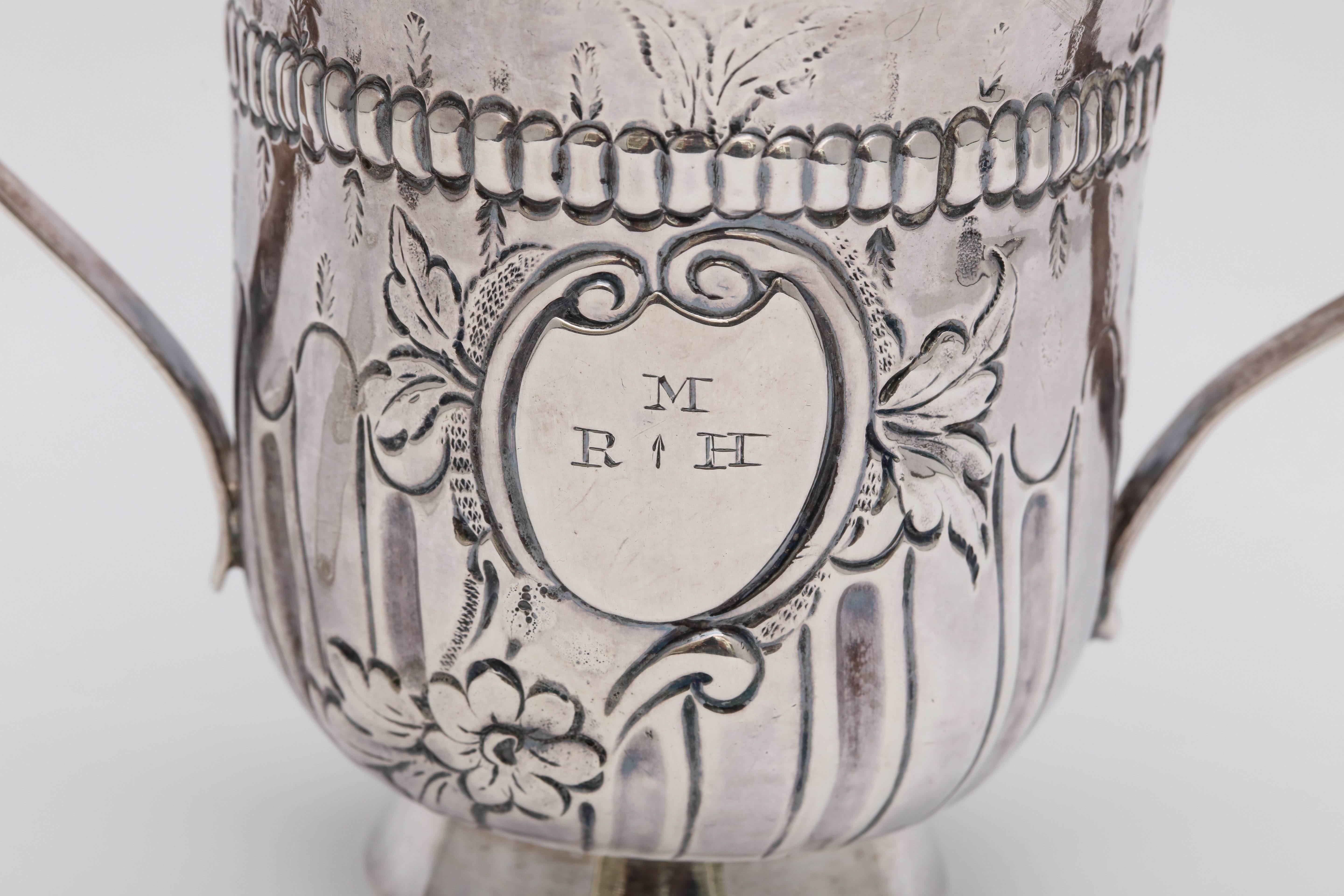 Georgian (George III), sterling silver, two-handled, pedestal based cup, London, 1768, John Kentenber - maker. Weighs 3.145 Troy ounces. Measures 3 1/2 inches high x 4 3/4 inches wide (handle edge to handle edge) x 3 inches diameter at widest point.