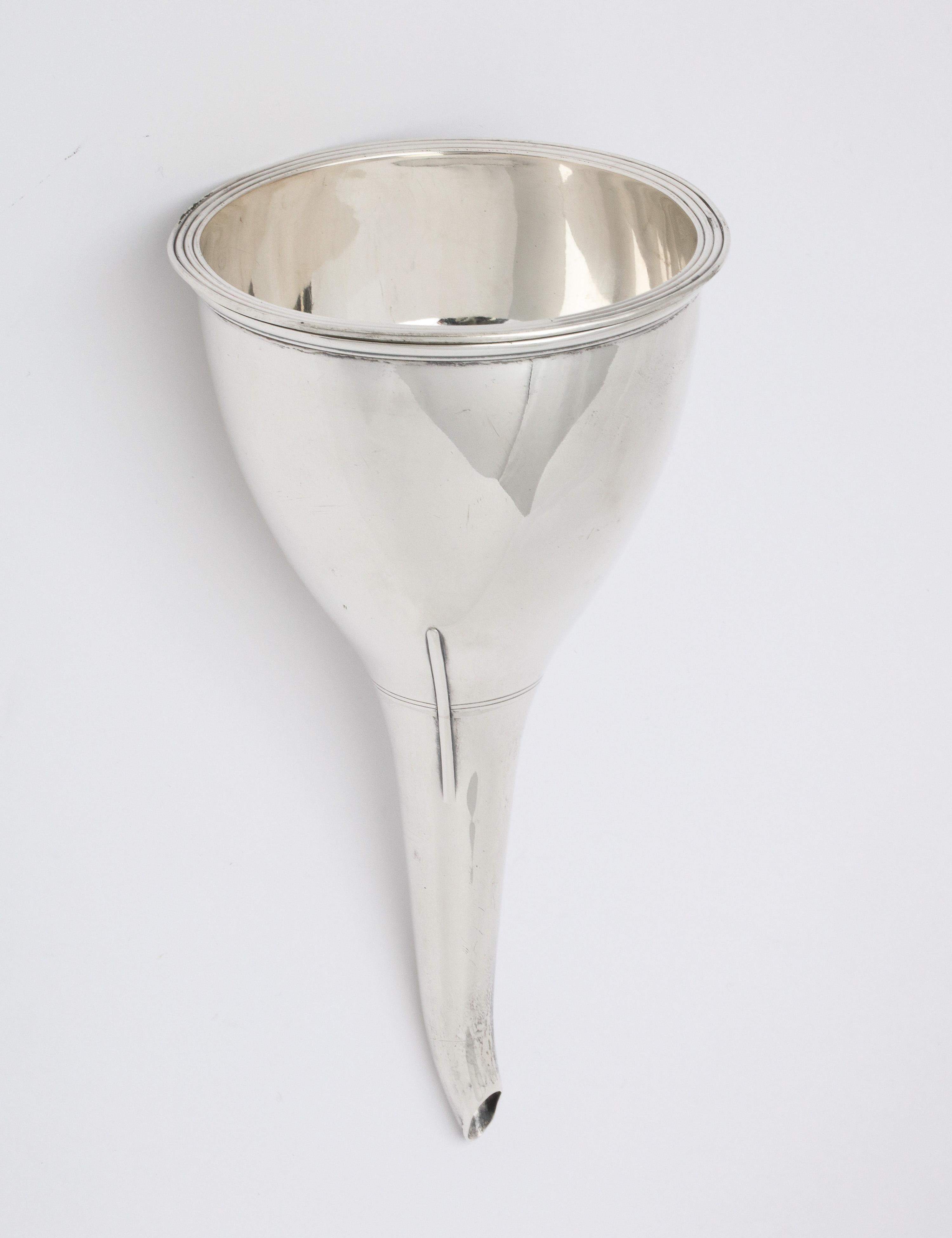 Georgian (George III) Period, sterling silver wine funnel, London, England, year - hallmarked for 1818, William Bateman - Maker. Measures 6 1/2 inches high to top of spout x 3 1/4 inches diameter at widest point. Separates into three sections (see