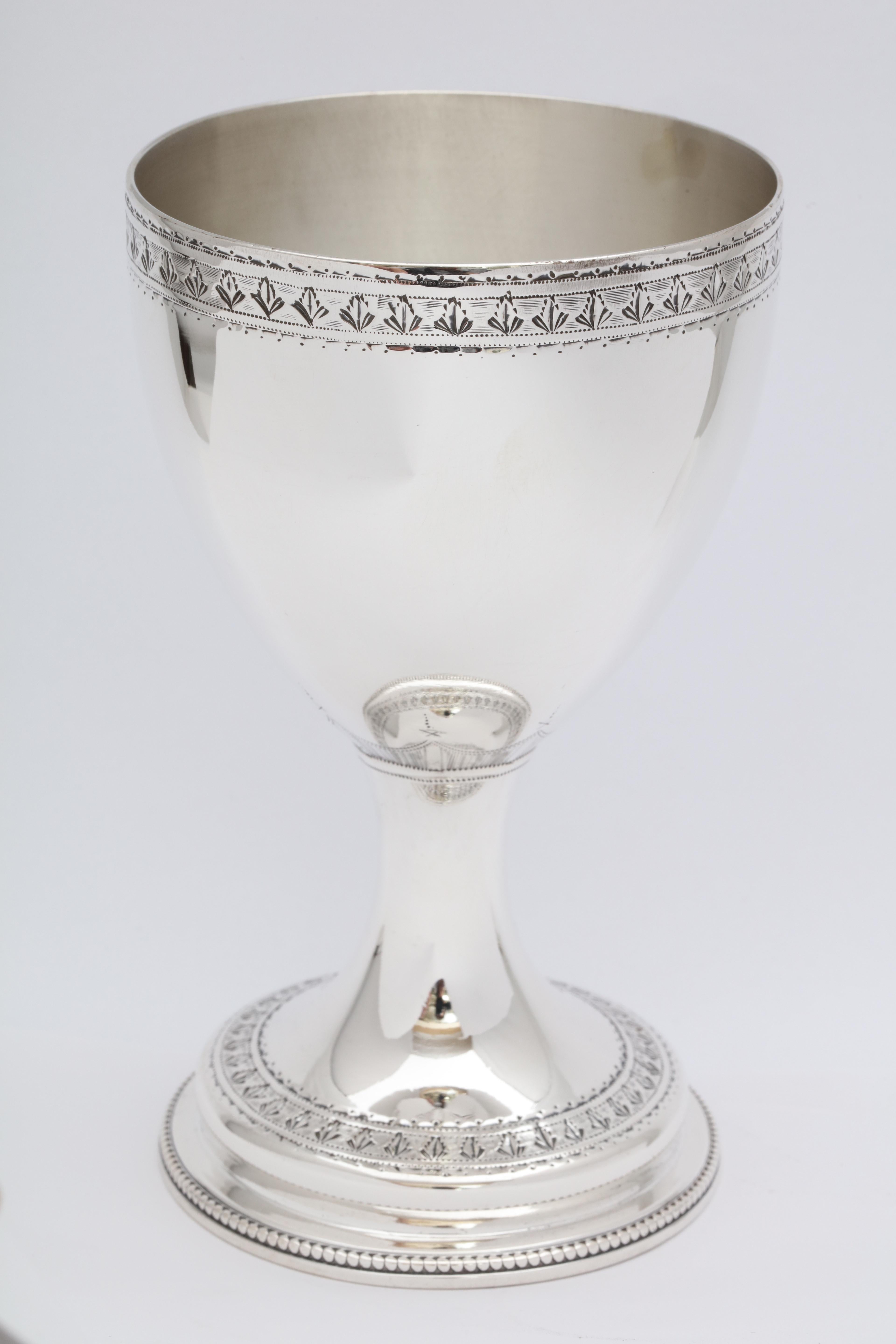 Georgian (George III), sterling silver goblet, London, 1778, Charles Wright - maker. Etched work on rim; etched motif is continued on base. Applied sterling bead work on border of bottom rim. Measures over 5 1/2 inches high x 3 1/2 inches diameter