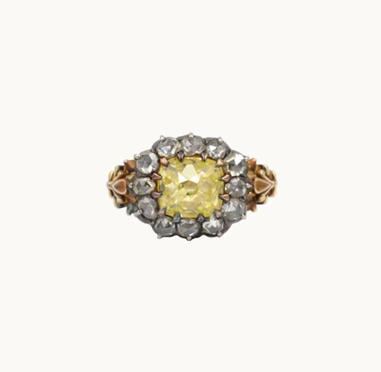 Georgian antique yellow diamond cluster ring in silver topped 18 karat yellow gold from circa the 1820s.  A very special and rare piece in incredible condition! At center of the cluster is a 2.96 carat antique cushion cut fancy intense yellow