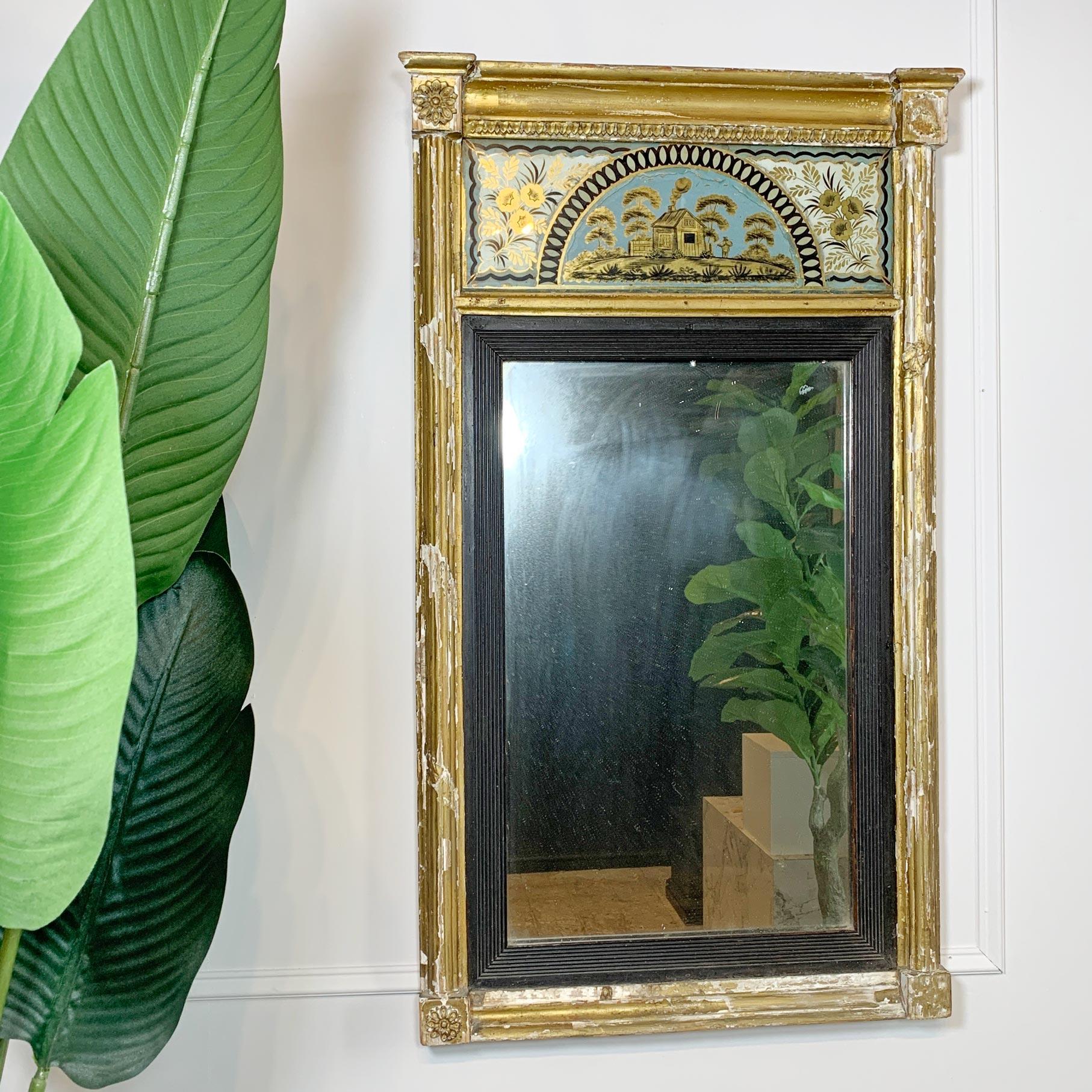 Achingly pretty Georgian period mirror, gilt-gesso surround with reeded insert around the original mercury plate. The verre eglomise frieze of a harvest scene, with gilded edging.

The plate and frieze are in superb condition, the frame is