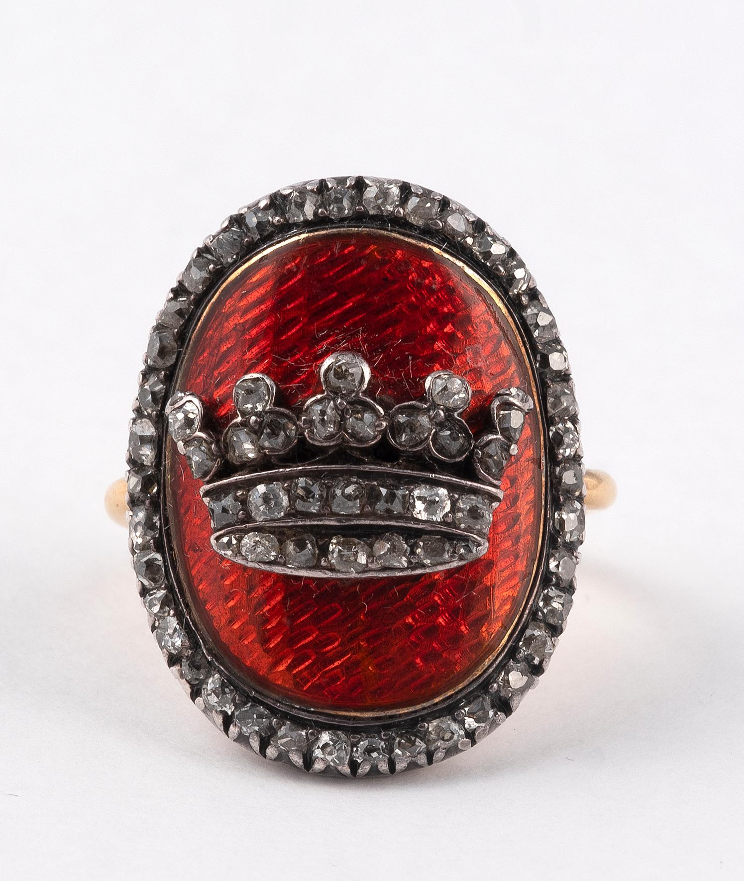 Ring in yellow gold 18 carats and silver decorated with a crown on a red guilloche background and set with diamonds cut in rose.
Size of finger: 5 
Gross weight: 9,6 g
