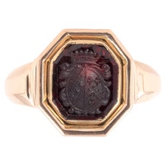 Anello con stemma di famiglia in oro georgiano e granato