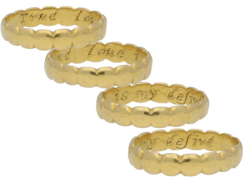 Georgian gold posy ring 'True loue is my desire'. A yellow gold band with softly scalloped edging, engraved to the interior 'True loue is my desire', approximately 3.7mm in width. Tested yellow gold, approximately 2.8g in weight, circa 18th century.