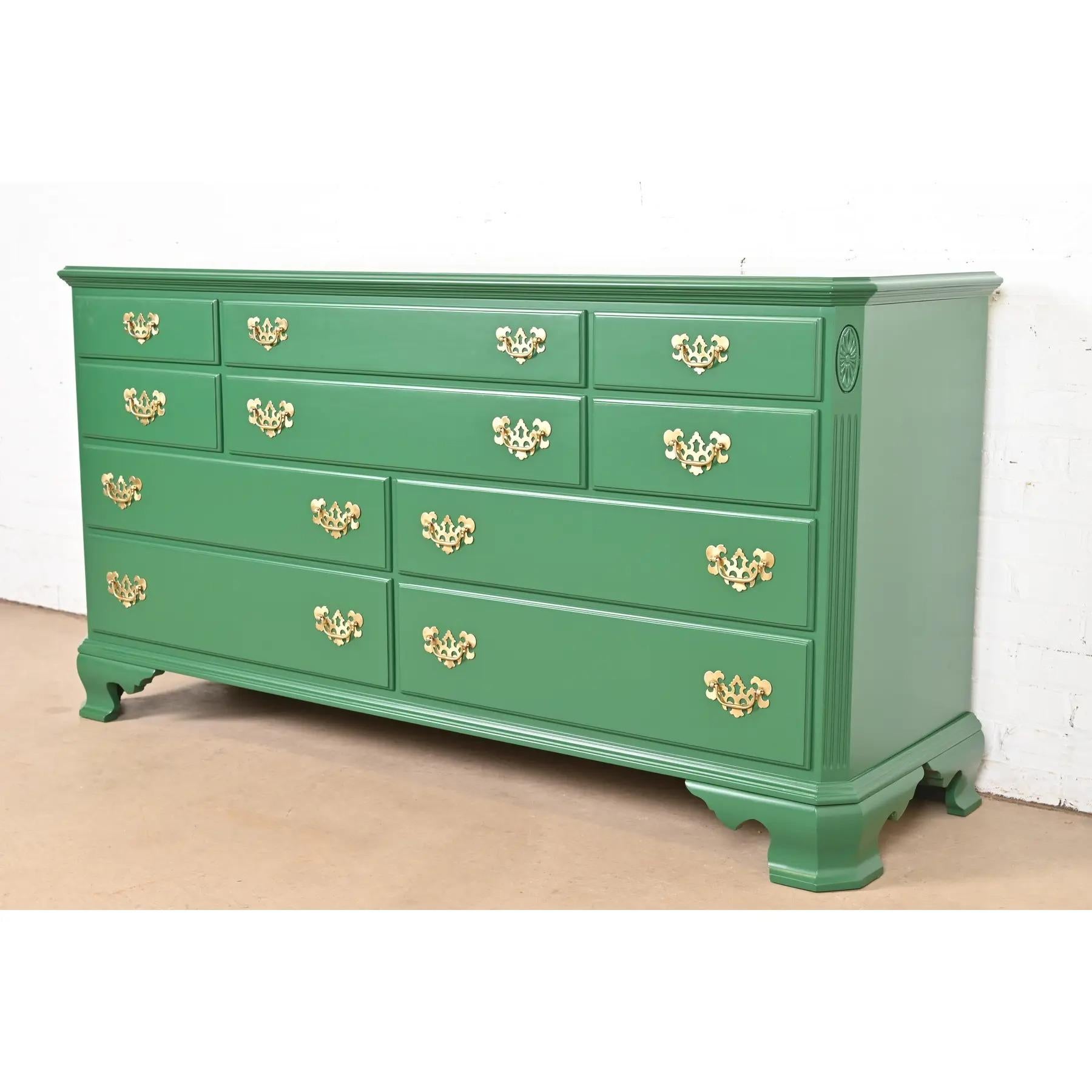 A gorgeous Georgian or Chippendale style ten-drawer dresser or credenza

USA, Circa 1970s

Green lacquered carved solid cherry wood, with original brass hardware.

Measures: 65.75