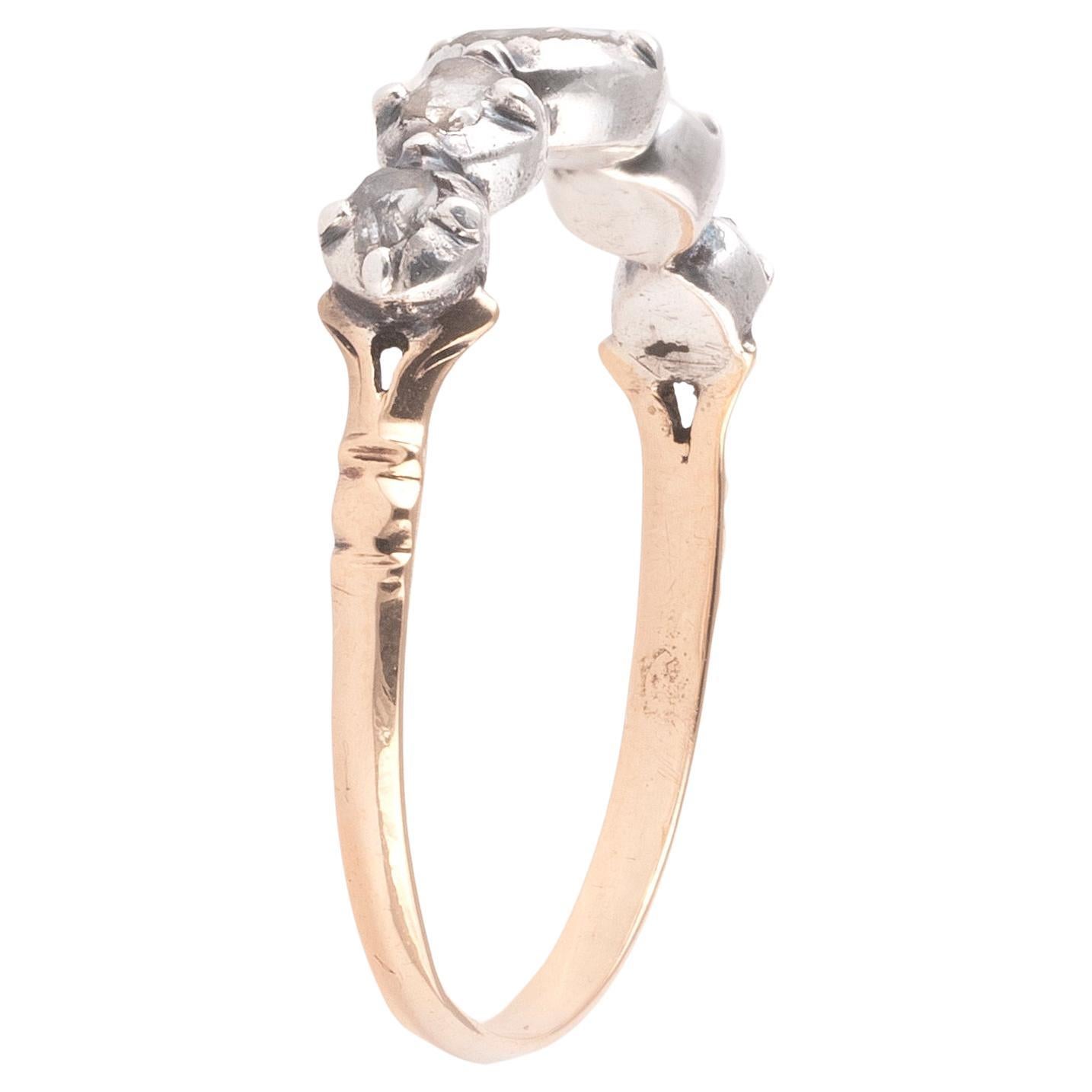 Antique ring (18K) gold and silver, set with rose-cut diamonds.
Weight: 1.73gr.
Size : 10

Georgian half hoop ring, set with five rose cut diamonds weighing roughly 0.7 ctw, in cut-down collet settings of silver-topped gold, which taper into a
