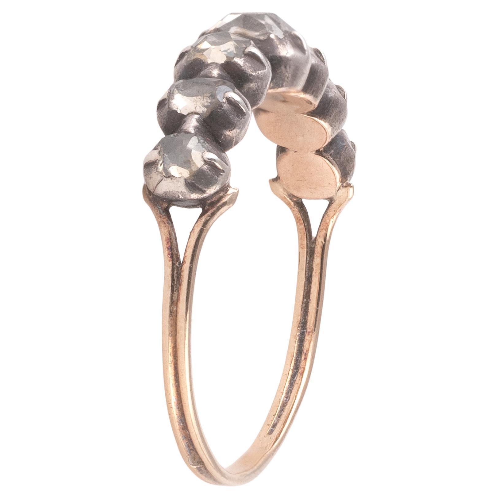 Antique ring (18K) gold and silver, set with rose-cut diamonds.
Weight: 2.28gr.
Size : 10

Georgian half hoop ring, set with seven rose cut diamonds weighing roughly 0.75 ctw, in cut-down collet settings of silver-topped gold, which taper into a