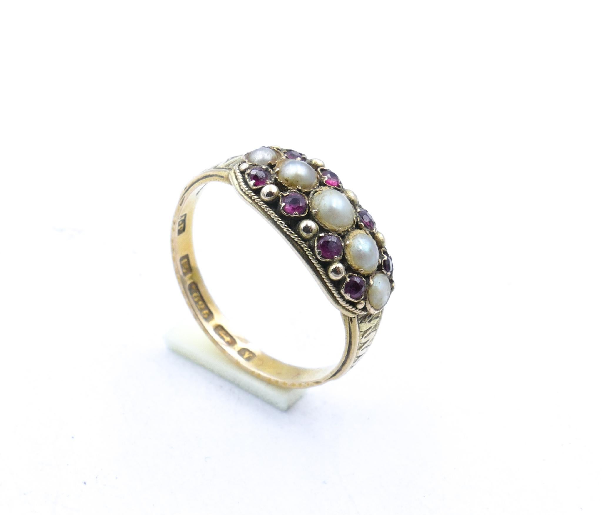 Beautifully hallmarked 'Birmingham', 'J.P', 'N' and beautifully preserved as well, is this gorgeous deeply coloured garnet & Seed Pearl traditional Band Ring.
Just a beautiful Collectors' Item in great condition.
Just look at the Hallmarks!
