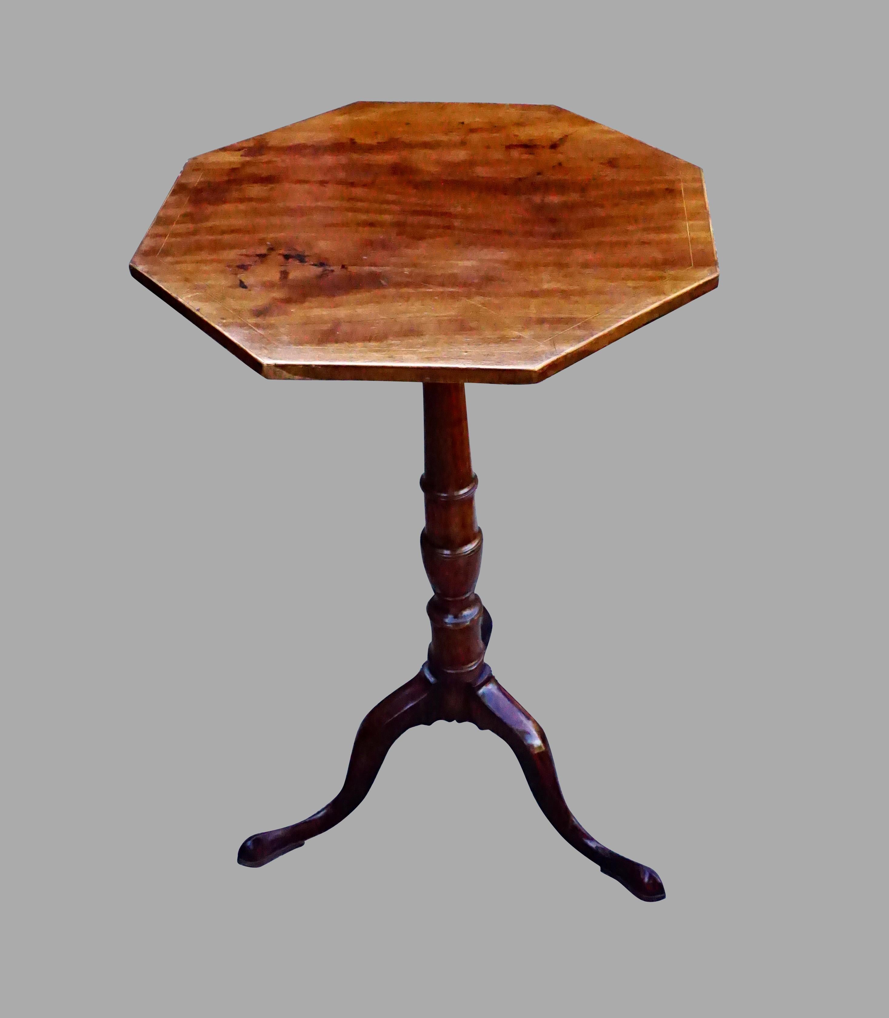 A charming English George III period inlaid mahogany tripod candle stand, the string inlaid hexagonal top supported on a turned column, terminating in a tripod base with cabriole legs ending in pad feet. Circa 1770. Attractive warm color, top with