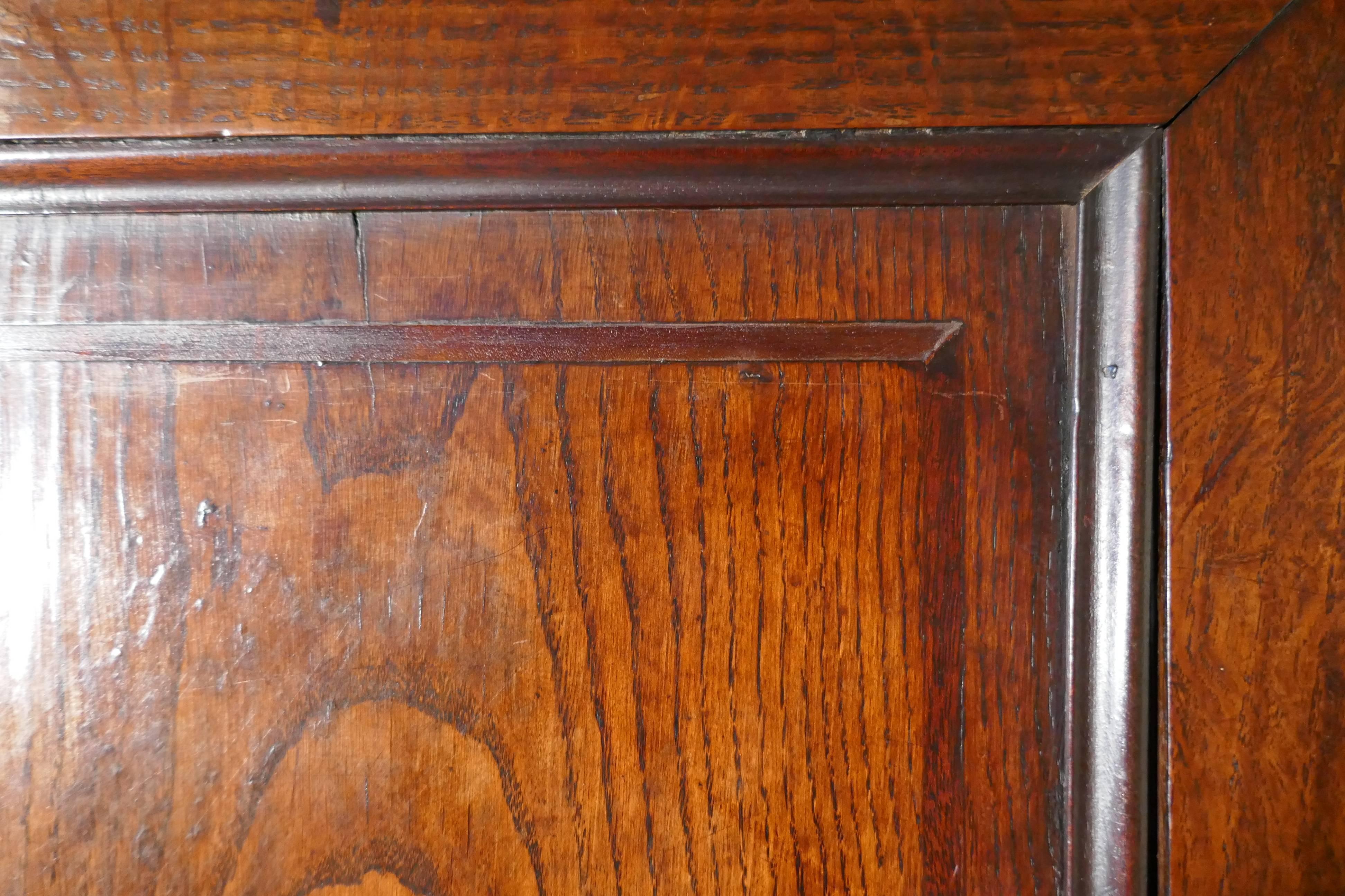 Georgian inlaid oak housekeepers or cloakroom hanging cupboard

The cupboard has two large doors enclosing a deep hanging cupboard, below the doors on the front there are two dummy allowing extra hanging length and three other drawers
The