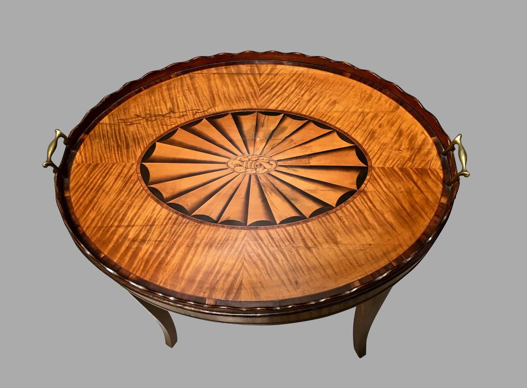 A fine quality Georgian inlaid satinwood tray with a beautifully rendered central inlaid fan medallion framed by a satinwood surround, with a scalloped edge, now supported on a custom stand of a later date. Tray, circa 1790.