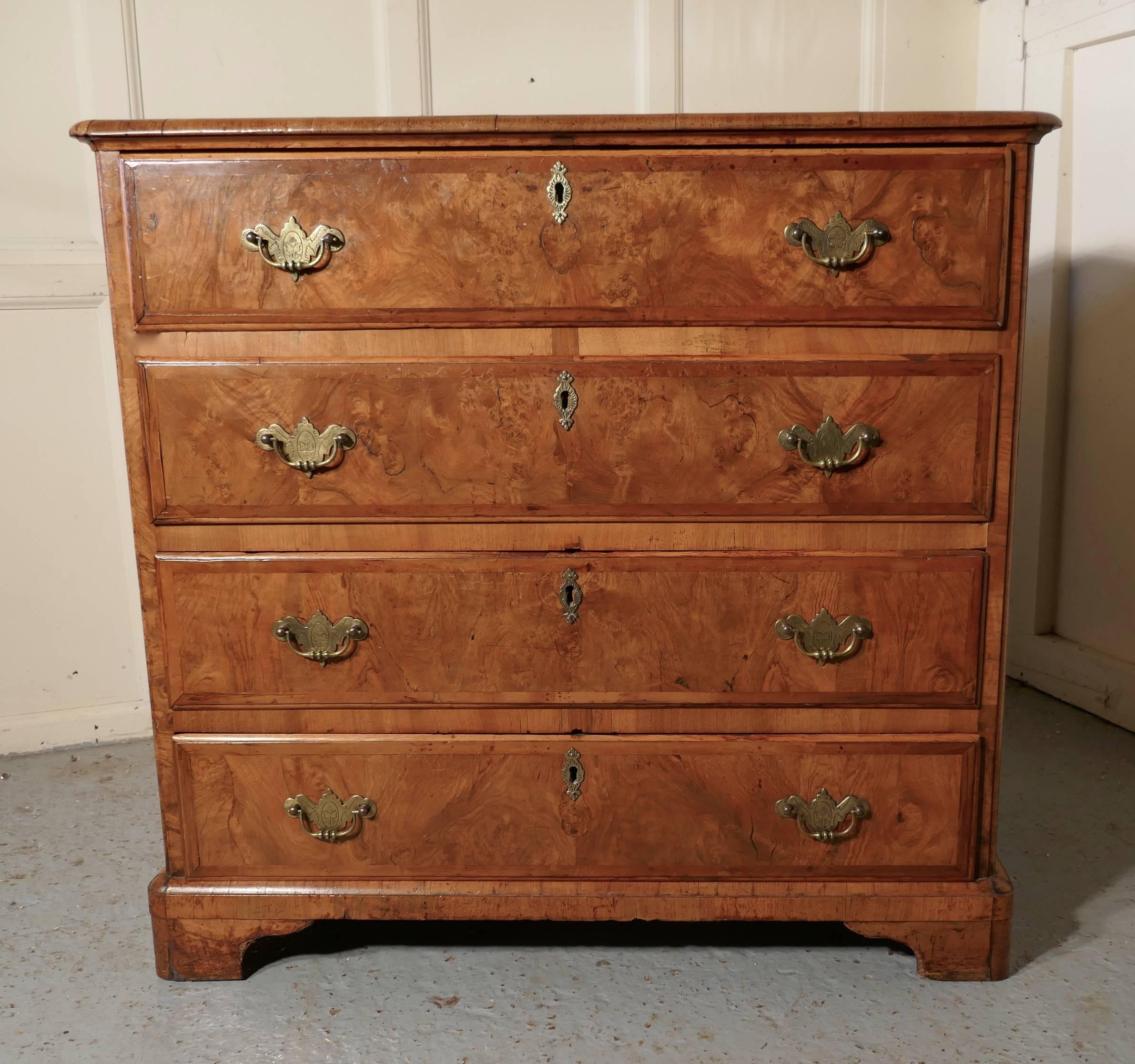 Georgian inlaid walnut chest of drawers 

This is a superb Georgian walnut chest of drawers, the veneers used have the most wonderful figuring.
The chest has four long drawers they have brass swan neck handles with etched back plates, matching