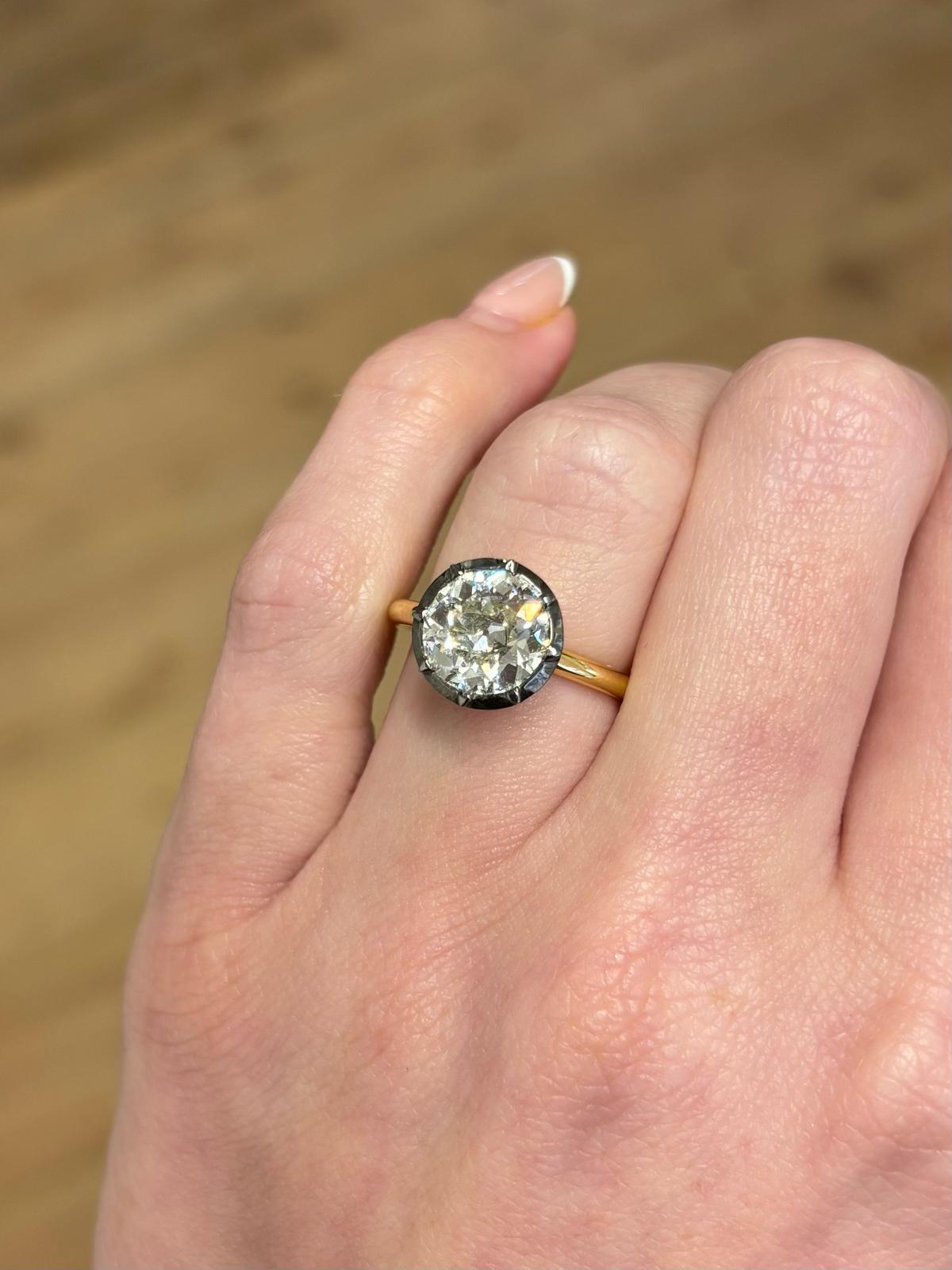 A sparkly Georgian inspired old cut diamond solitaire ring. 

The ring is solely set with a 2.65 carat old cut diamond which is set in a elegant Georgian inspired cut down setting. Traditionally, the head of the ring would have been set in silver on