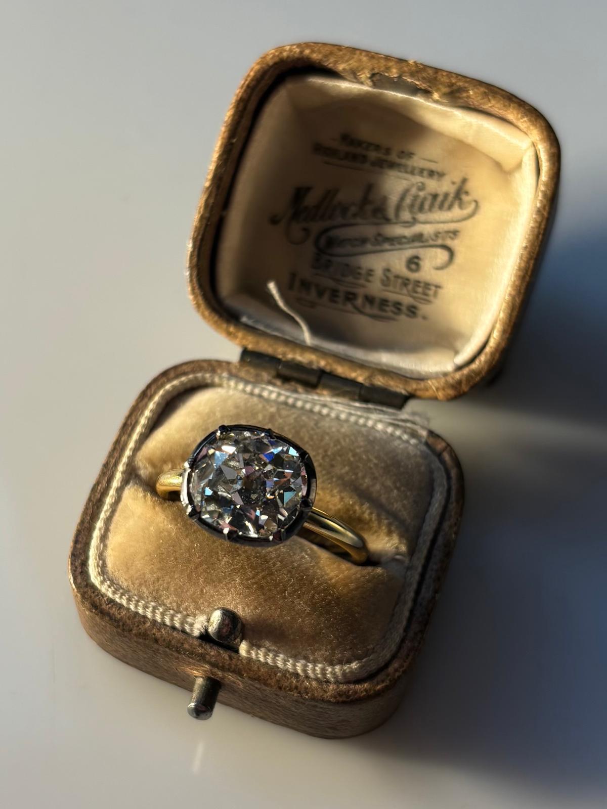 A sparkly Georgian inspired old cushion cut diamond ring set in 18k yellow gold. 

The ring is solely set with a 3.27 carat old cushion cut diamond which is set in a elegant Georgian inspired cut down setting. Traditionally, the head of the ring