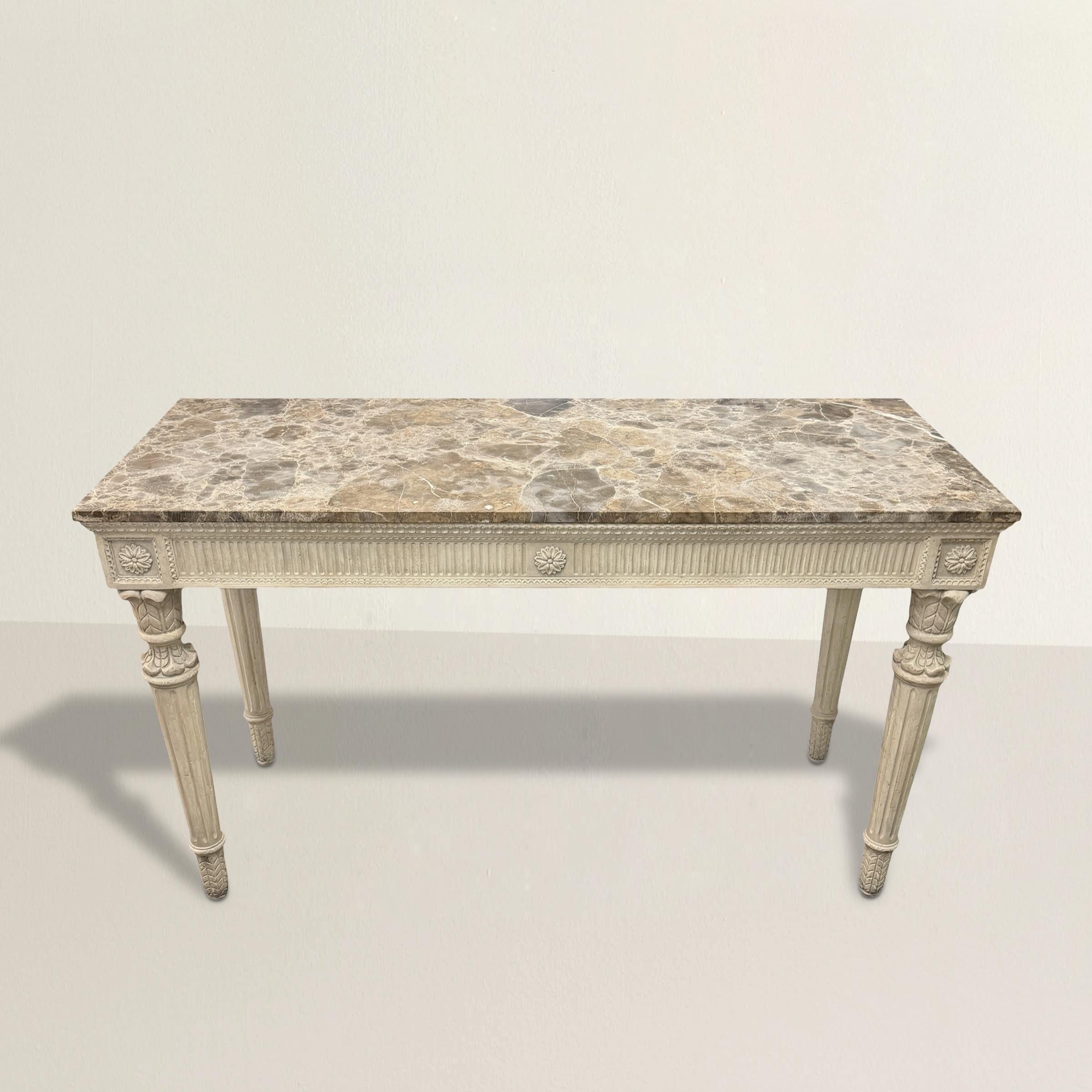 A refined blend of classical elegance and modern craftsmanship, this late 20th-century console table is a stunning homage to Georgian-inspired neoclassical design. Its hand-carved wooden frame features a fluted apron adorned with delicately sculpted