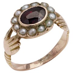 Georgian  Fede ring in 15kt. yellow gold and set with garnet and seed pearls 