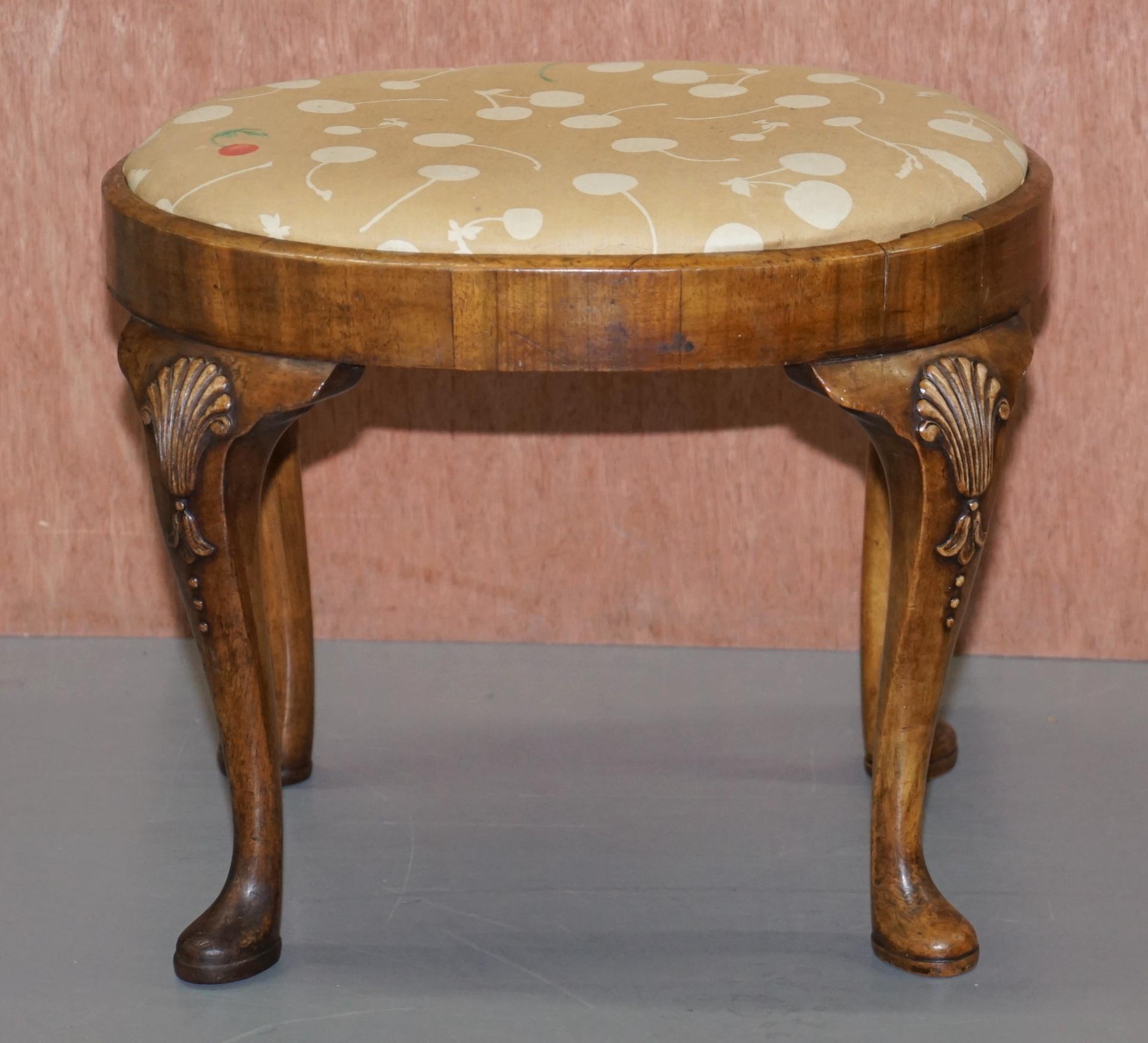 We are delighted to offer for sale this stunning Georgian Iris walnut stool with cherry berry upholstery

A very good looking well made and decorative stool, ideally suited for a dressing table, piano or bay window

The stool is made up of light