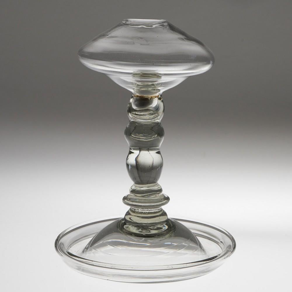 Heading : A Georgian 'lacemaker's' lamp c1780
Date : c1780
Origin : England
Colour : Clear, grey hue
Pontil : Snapped
Glass Type : Lead
Size : 14.2cm tall, 10.5cm diameter
Condition : Excellent, no chips or cracks. Some inclusions within the
