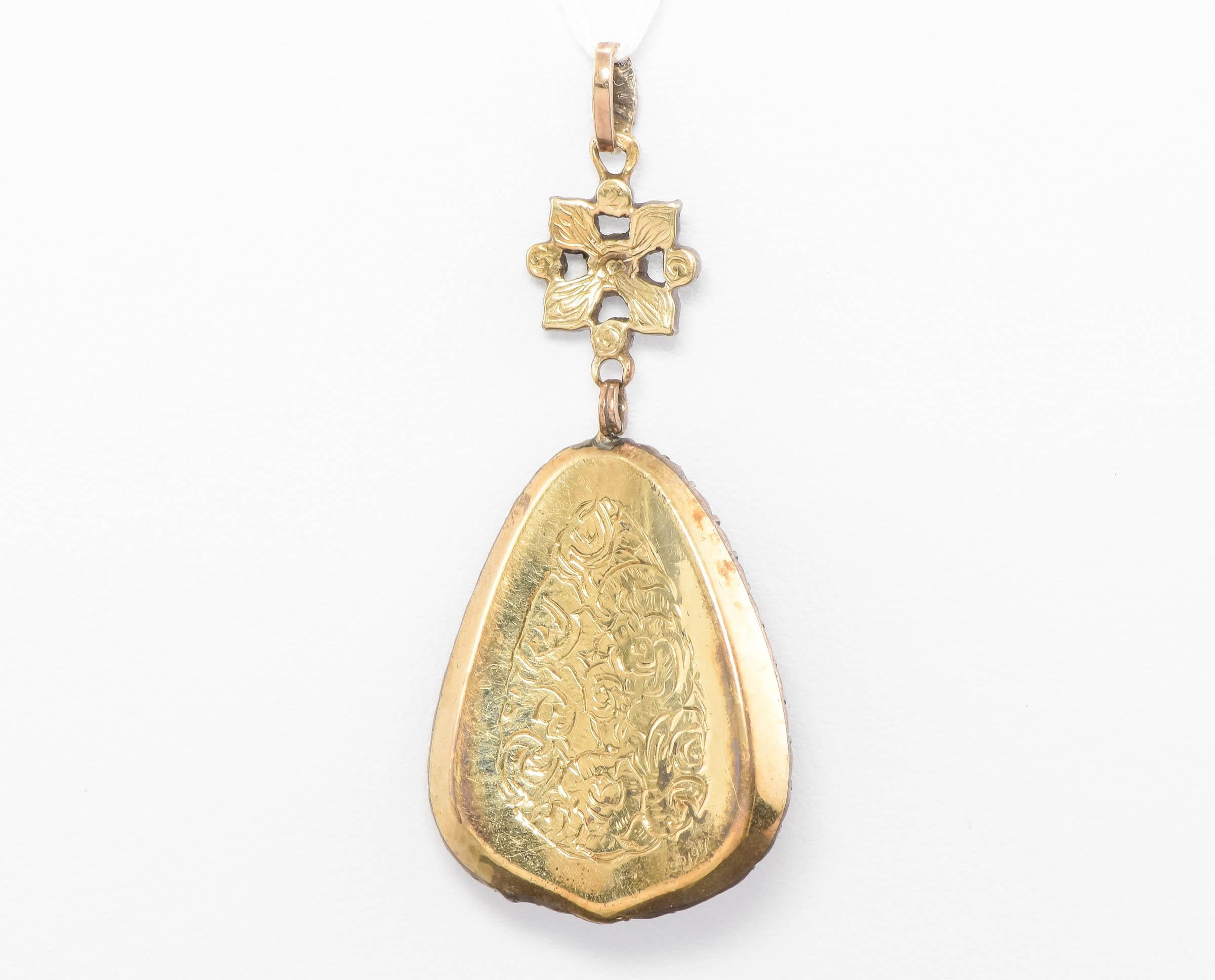 Absolutely stunning and a rare find, this original Georgian period Diamond Pendant with Bristol Blue Glass is gorgeous for the collector but is still very wearable, as well.

Crafted of yellow gold testing between 15K and 18K for me, with silver