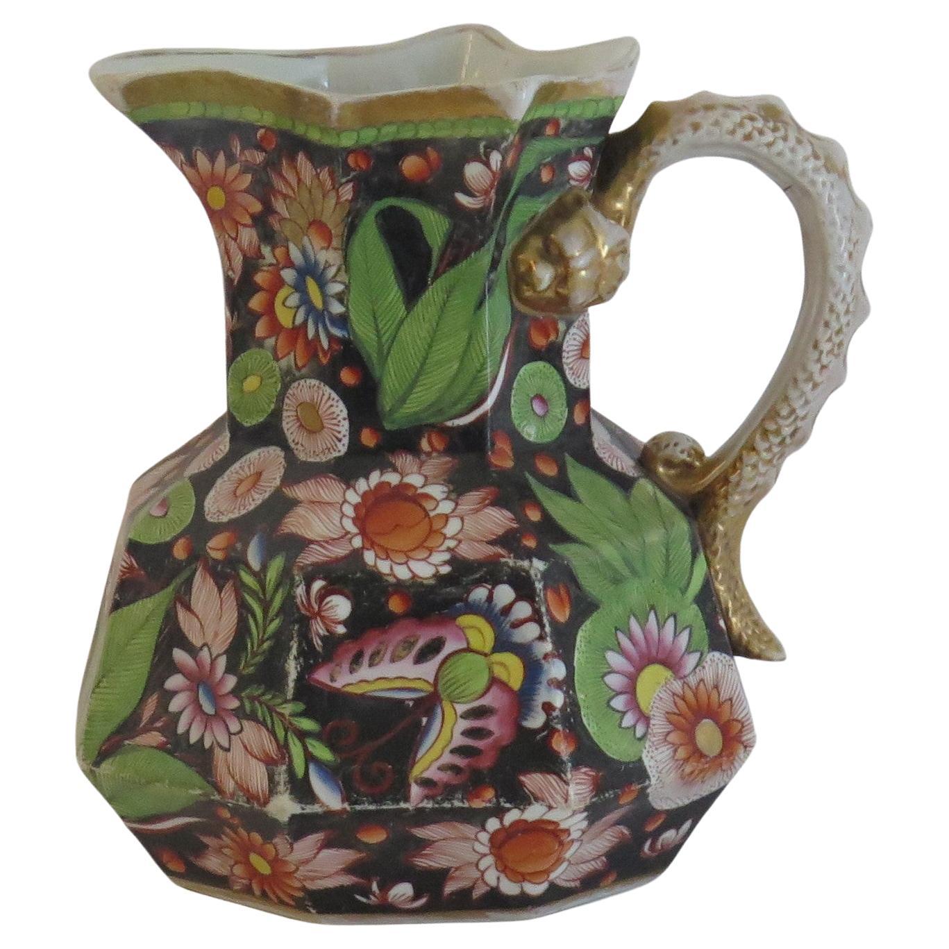This is a Large hand-painted Mason's ironstone jug or pitcher, in the very rare Butterflies & Flowers gilded pattern, from their earliest George 3rd period, circa 1815. 

The jug is well potted in their octagonal 