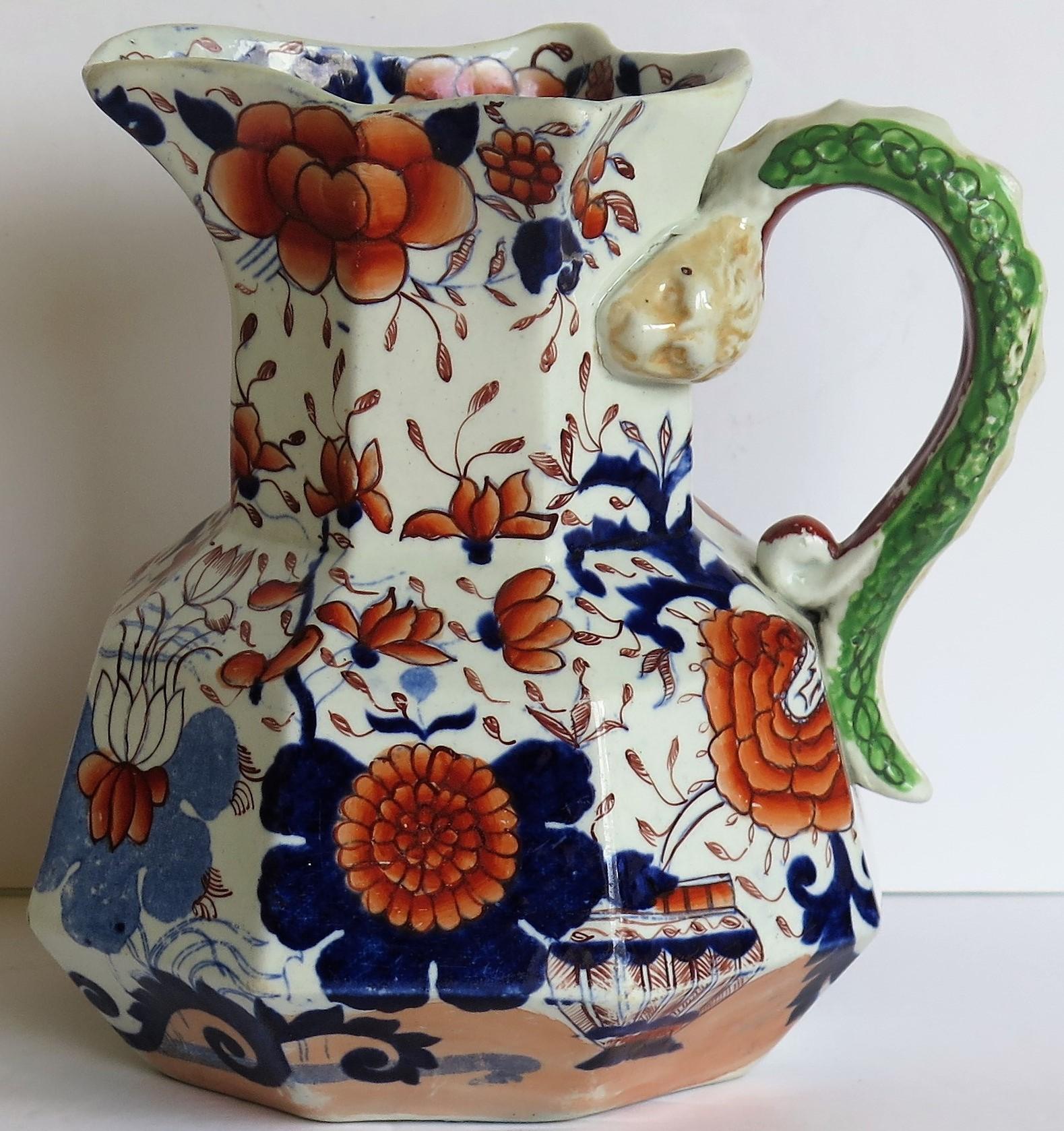 This is a good, large, early Mason's Ironstone Hydra jug or pitcher in the basket Japan pattern, made in the English, late Georgian period, circa 1815-1820.

The jug has an octagonal shape with a notched snake handle and is decorated in the