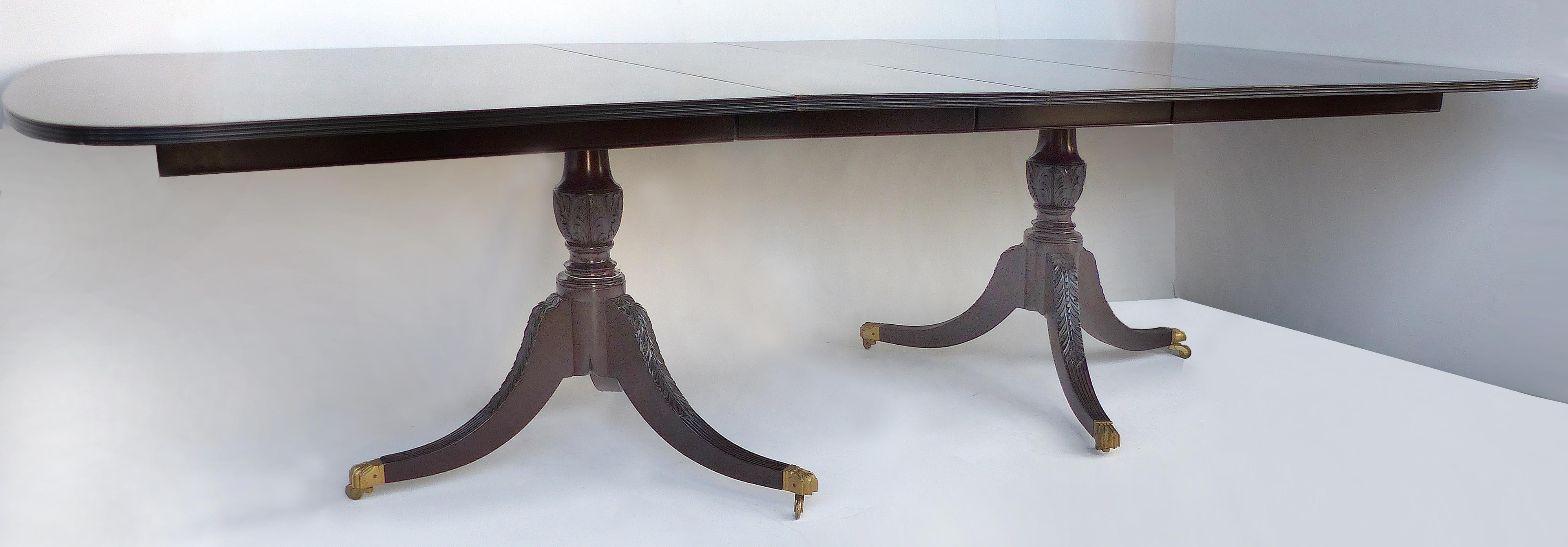 Georgian Late 18th Century Mahogany Double Pedestal Dining Table with Leaves

Offered for sale is an antique late 18th century Georgian double pedestal mahogany dining table with two leaves that each measure 18.5