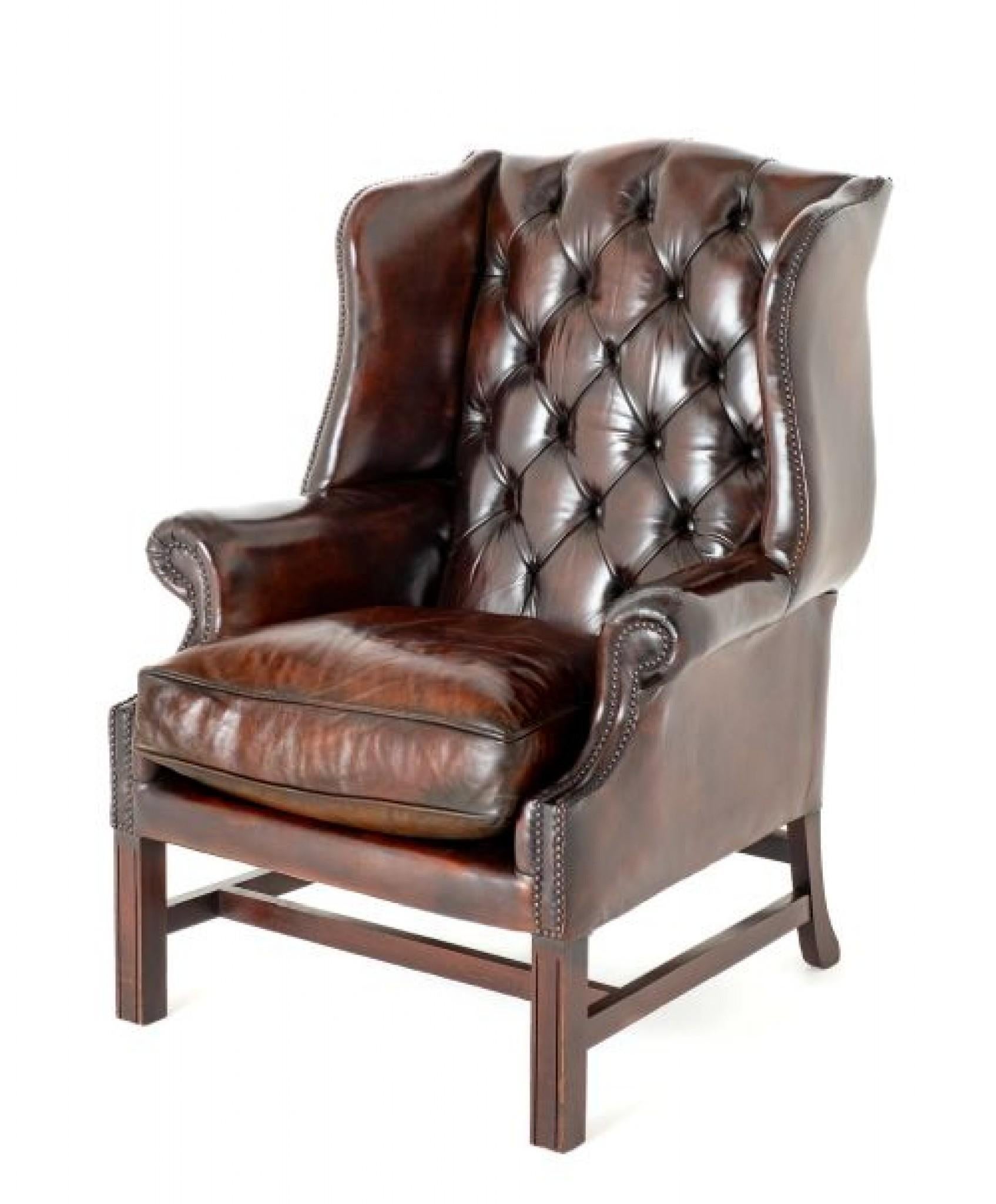 Georgian Revival Leather Wing Chair.
A leather wing chair is a classic piece of furniture typically featuring a high back with 