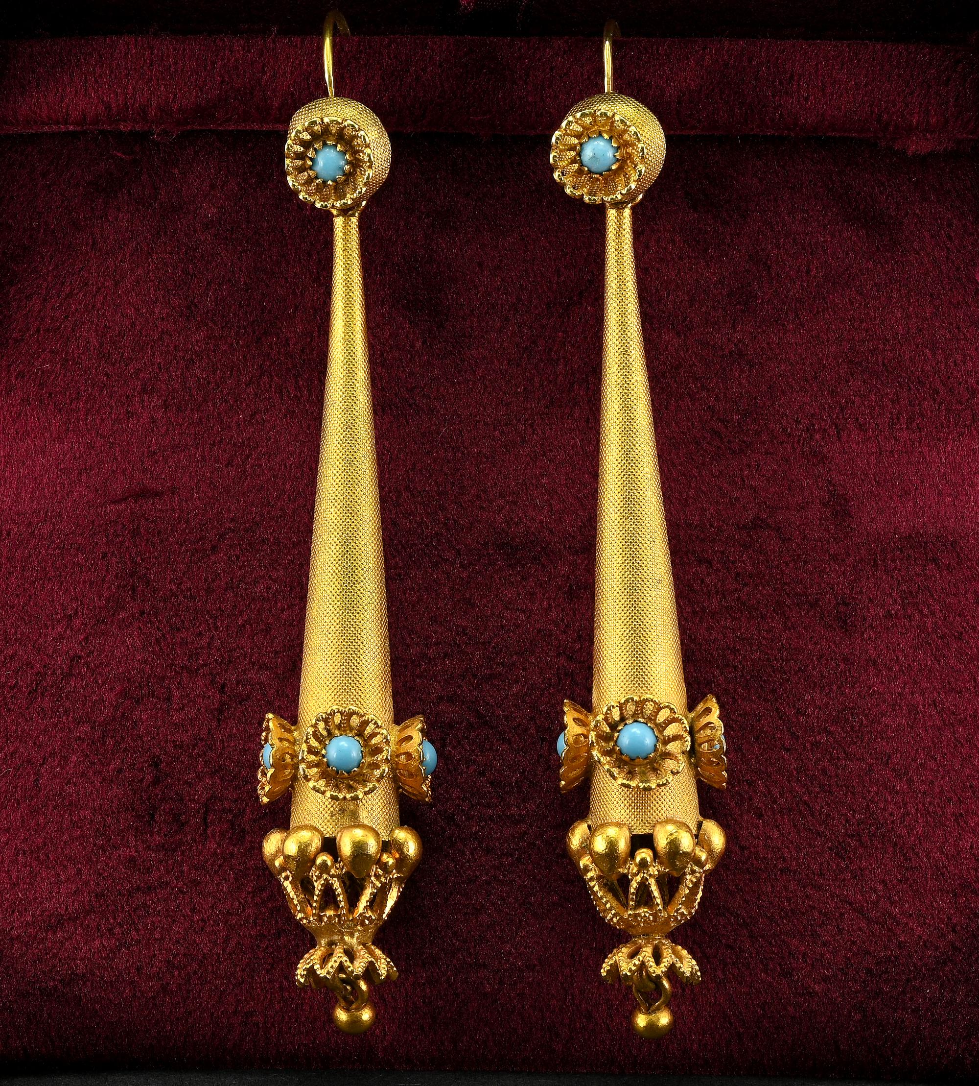 Fascinating pair of long torpedo earrings, Georgian period 1790 circa, solid 10 KT gold
English origin
Marvelous antique workmanship made with granulation texture throughout and pierced Turquoise set flowers Etruscan inspired work at the bottom
Tops