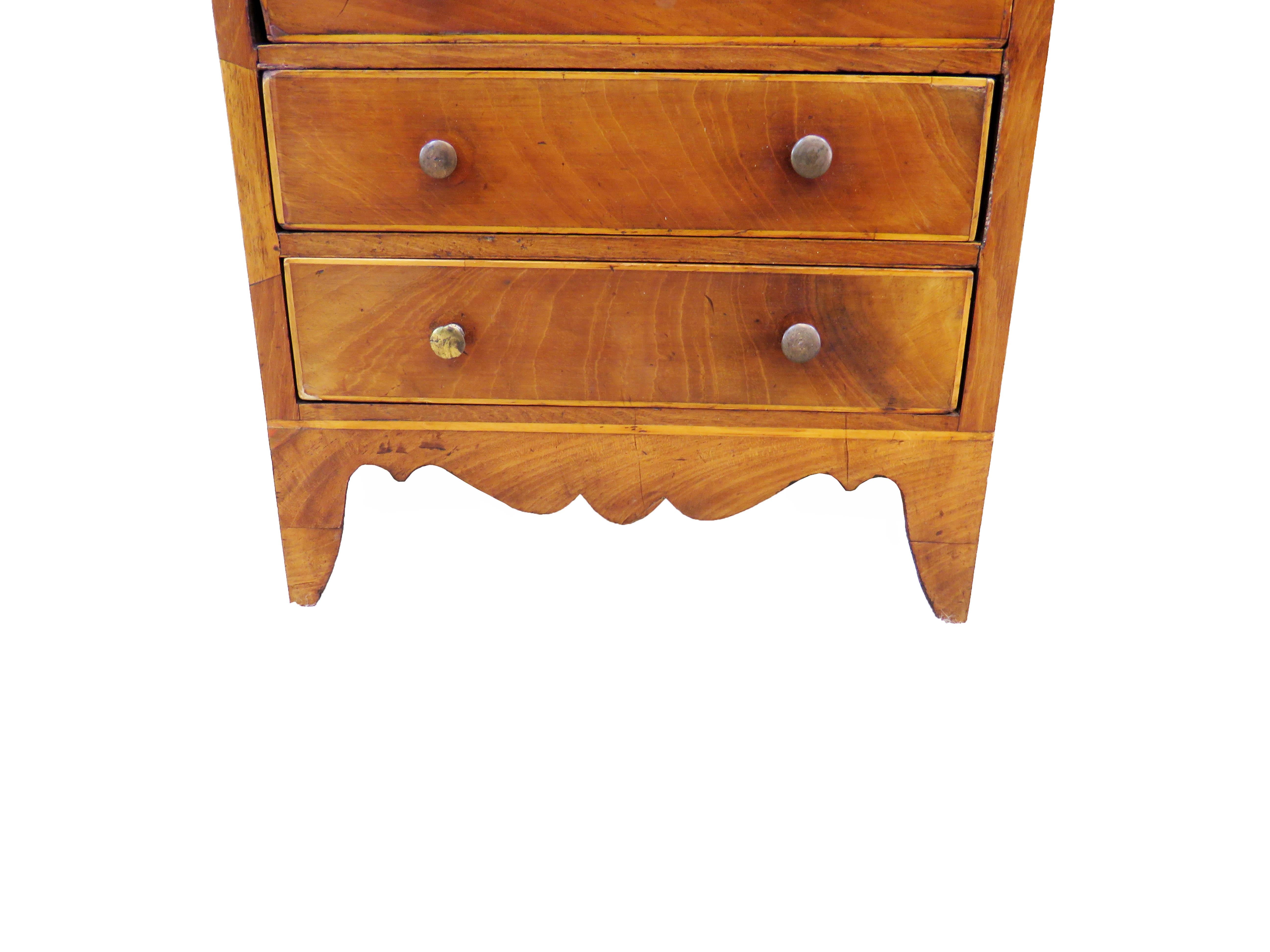 A charming late 18th century mahogany miniature chest
having three long drawers with brass handles
raised on elegant splayed feet

(Much discussion is had over the original purpose of 
almost all miniature furniture and the simple answer is