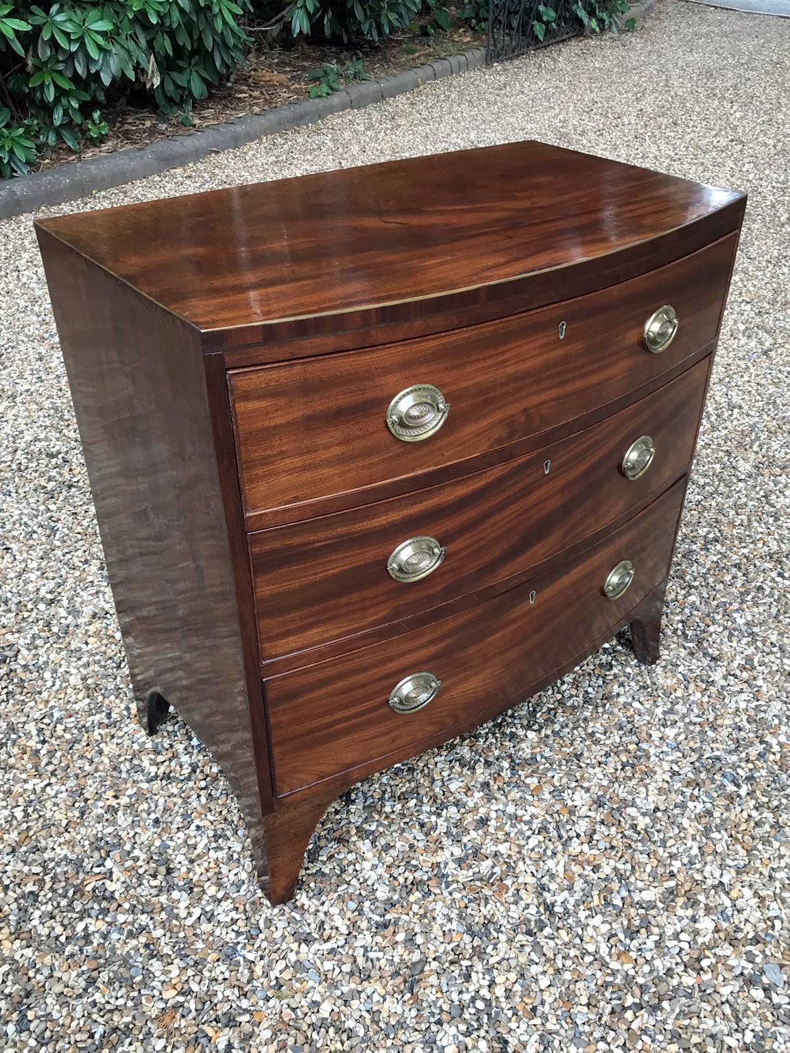 A Georgian mahogany bowfront chest of drawers of three long drawers and brass oval handles on splayed feet

circa 1790–1820

Dimensions:
Width: 33 inches – 84 cms
Depth: 17 inches – 43 cms
Height: 33 inches – 84 cms.

 