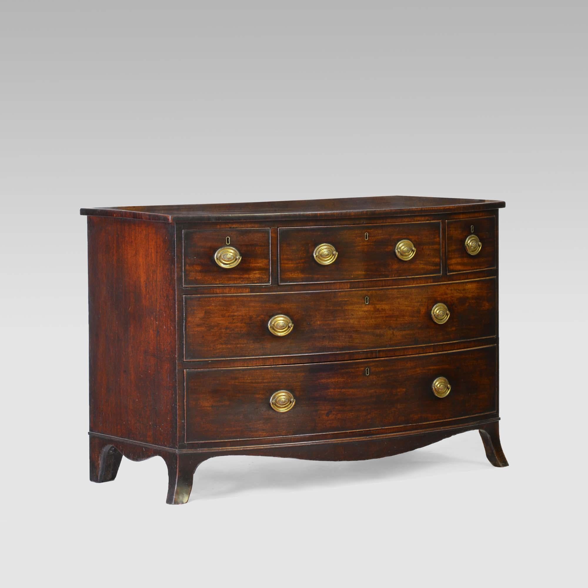 A fine George III mahogany bowfront chest of drawers in well-figured Cuban mahogany. Of large scale, low 3 drawer proportions and swept feet, all in the French commode style, united by a frieze of serpentine form.  The drawers all with cockbeading