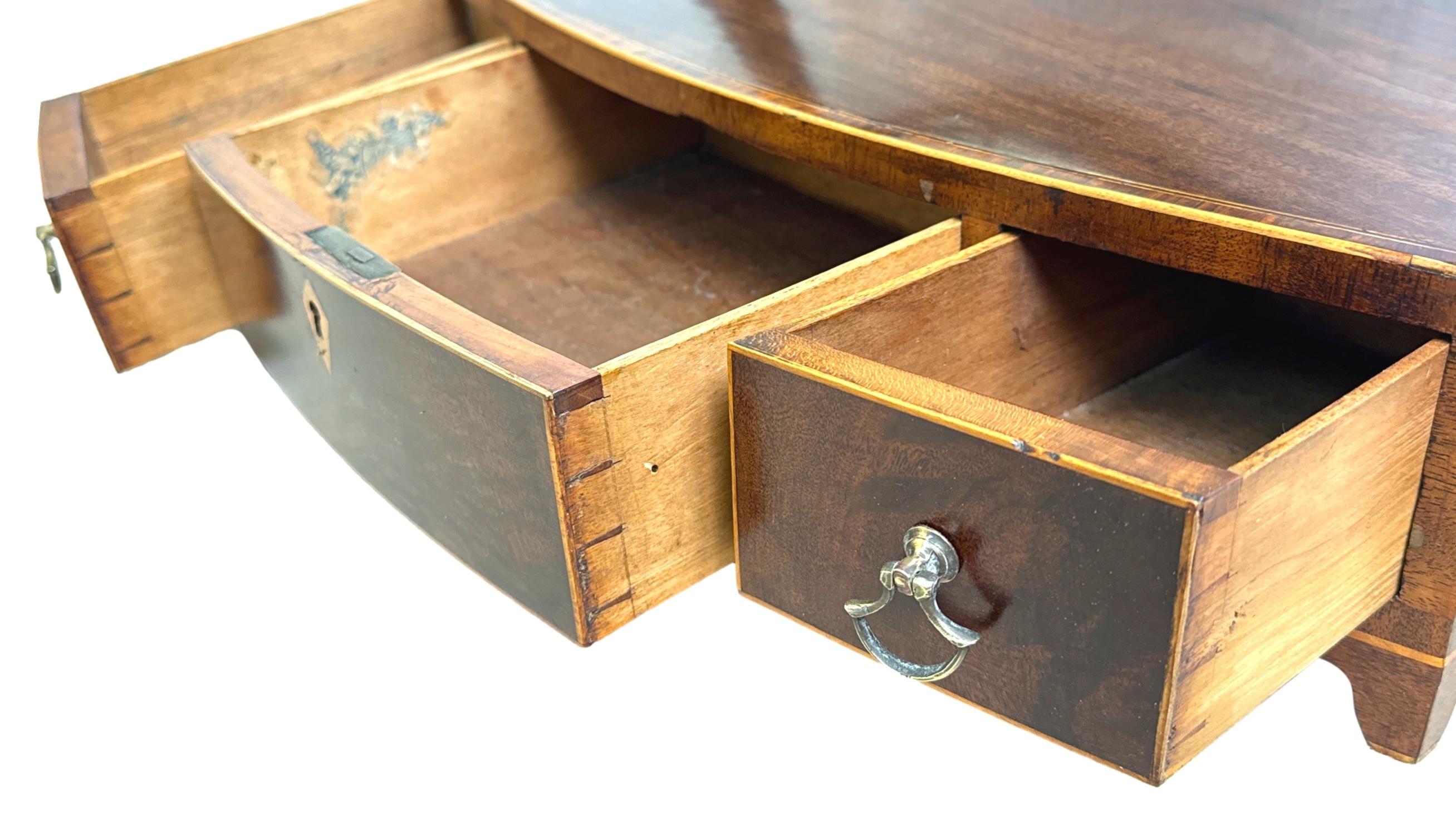 A Very Good Quality Late 18th Century, Sheraton Period, Georgian Bowfronted Mahogany Dressing Table Mirror, With Original Oval Swing Mirror Plate, Over Well Figured Bow Base With Three Drawers, Inlaid Decoration And Original Shaped Bracket