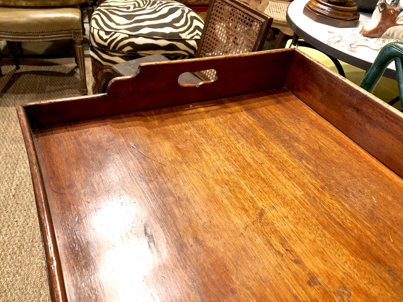 This is a great example of a 19th century Georgian mahogany butler's tray that retains its original patinated mahogany surface.