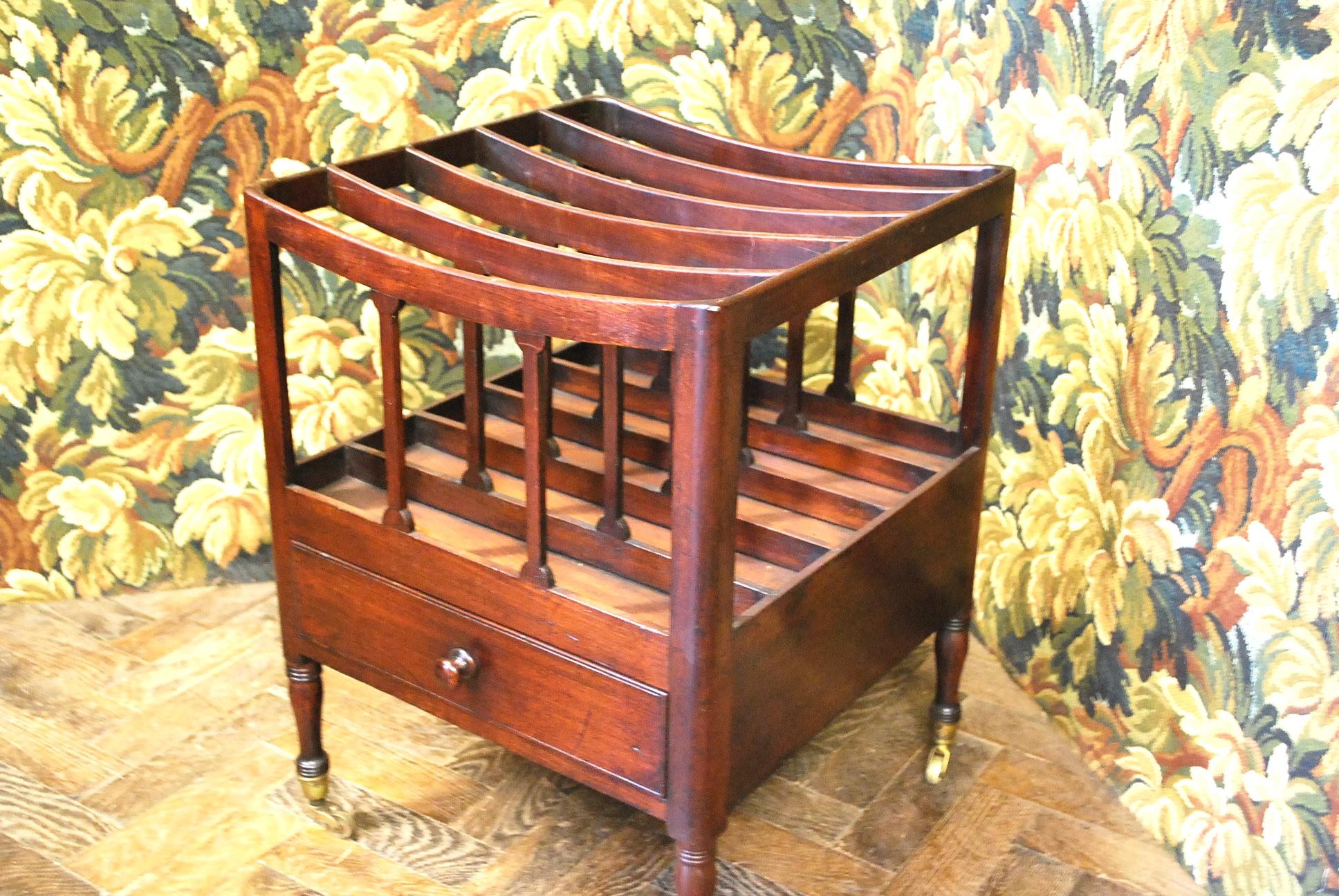 Presenting a truly unique find from the 18th Century Georgian era, we are delighted to introduce this exceptional Antique Mahogany Canterbury/Magazine Rack. What sets this piece apart is its uncommon extra division, lending it an intriguing country